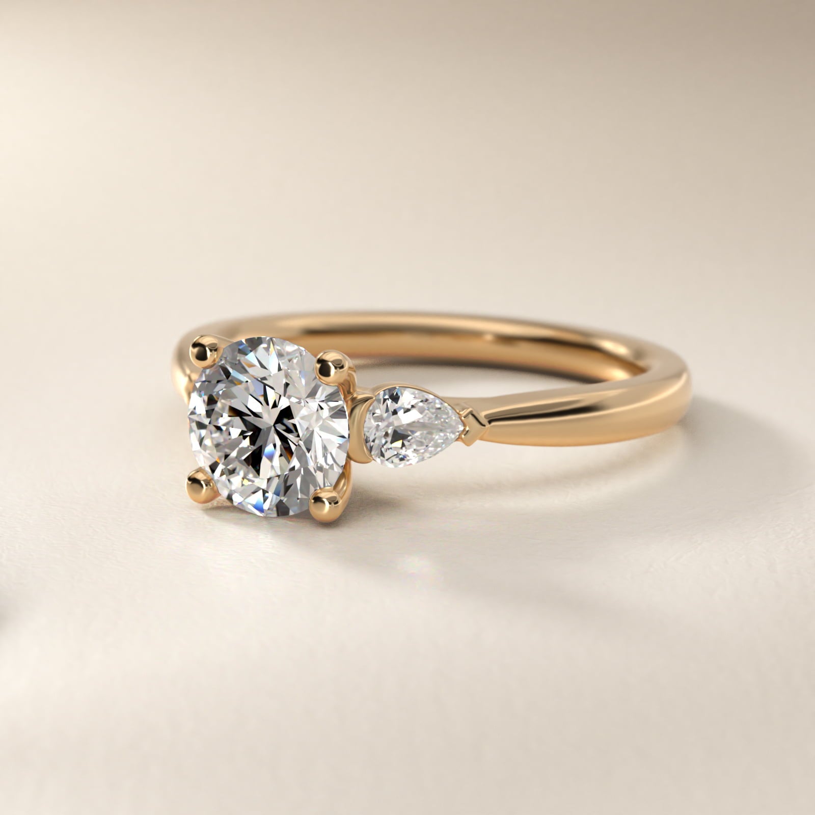 Pear Sidestone Diamond Engagement Ring in 14k Yellow Gold (1/4 ct. tw.) - Round Center