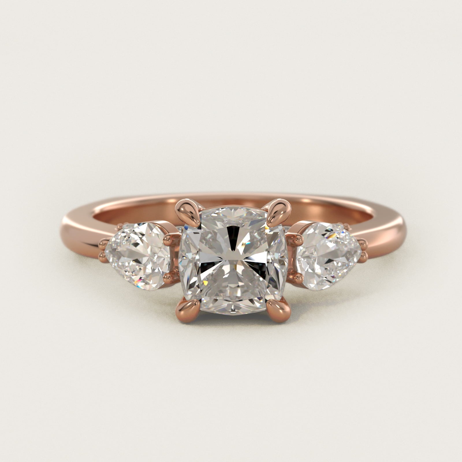 Pear Three Stone Engagement Ring in 14k Rose Gold (5/8 ct. tw.) By Bella Vaughan - Cushion Center