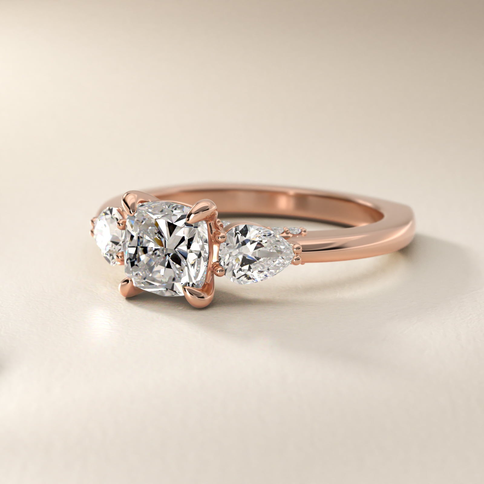 Pear Three Stone Engagement Ring in 14k Rose Gold (5/8 ct. tw.) By Bella Vaughan - Cushion Center
