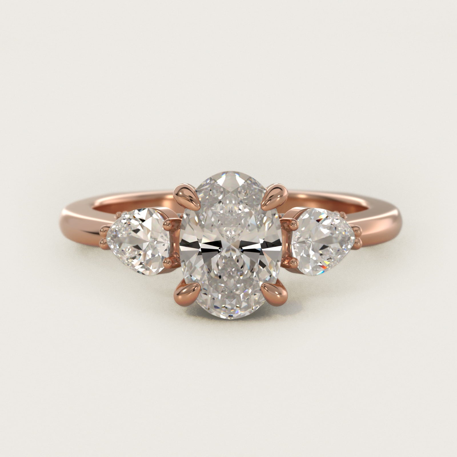 Pear Three Stone Engagement Ring in 14k Rose Gold (5/8 ct. tw.) By Bella Vaughan - Oval Center