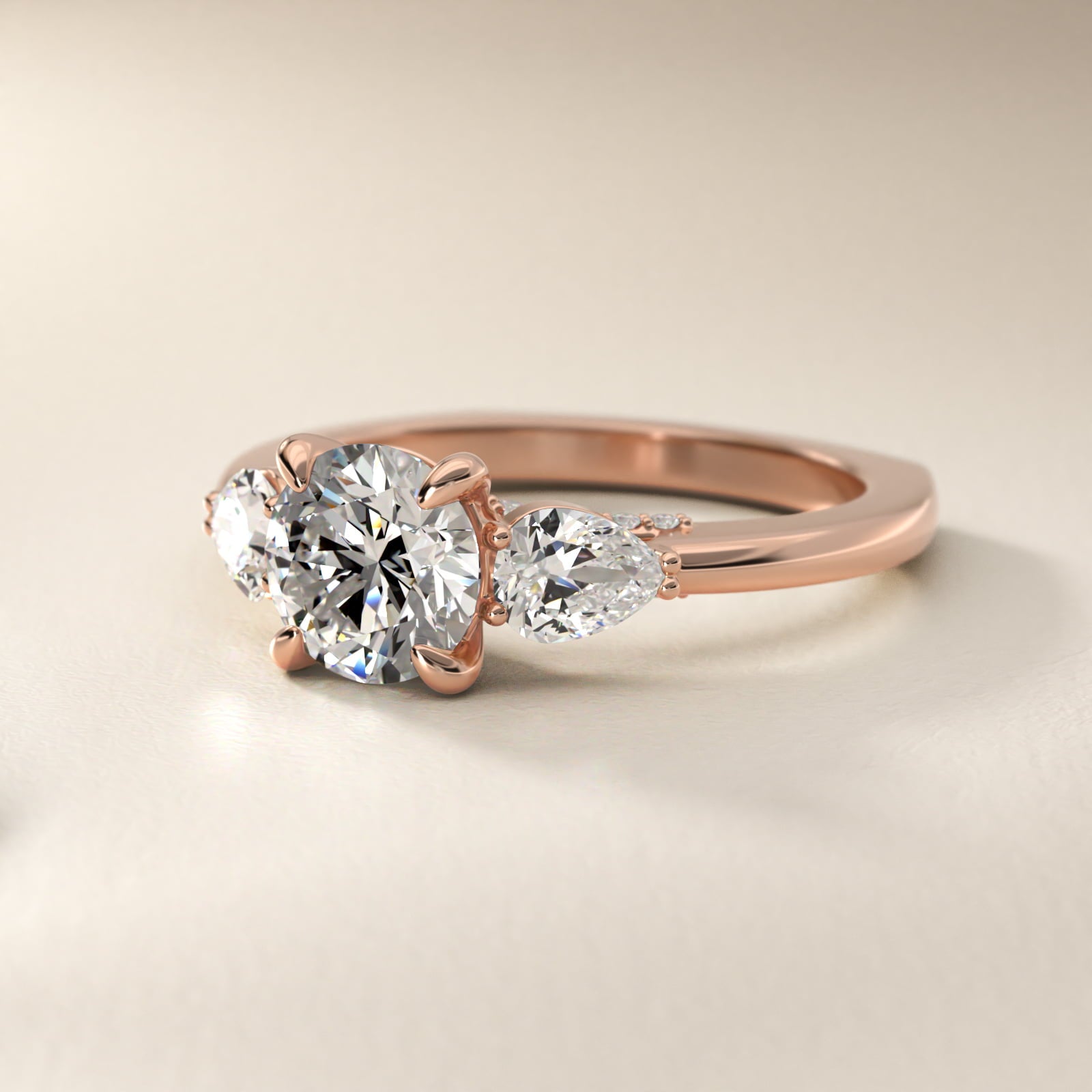 Pear Three Stone Engagement Ring in 14k Rose Gold (5/8 ct. tw.) By Bella Vaughan - Round Center