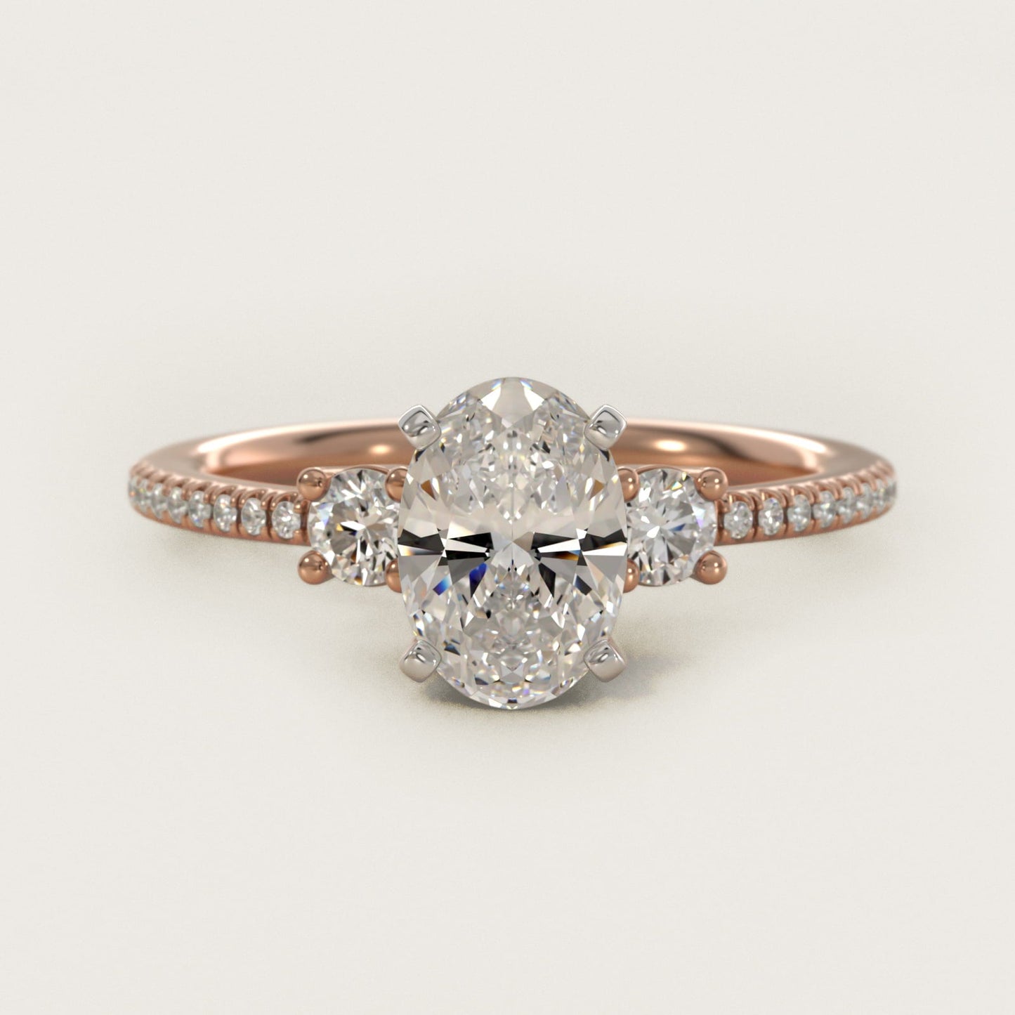 Petite Micropav? Trio Diamond Engagement Ring in 18k Rose Gold (1/5 ct. tw.) - Oval Center