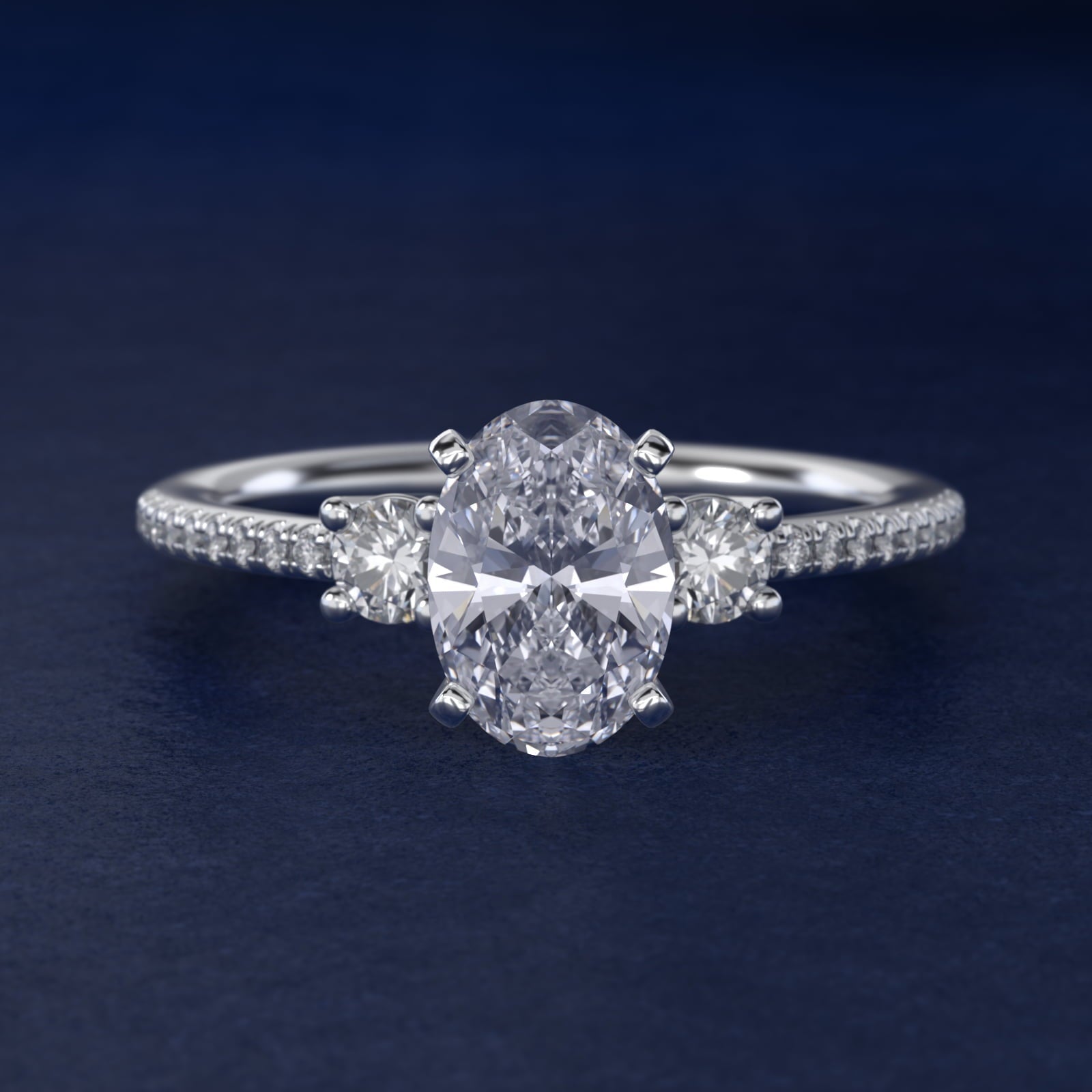 Petite Micropav? Trio Diamond Engagement Ring in Platinum (1/5 ct. tw.) - Oval Center