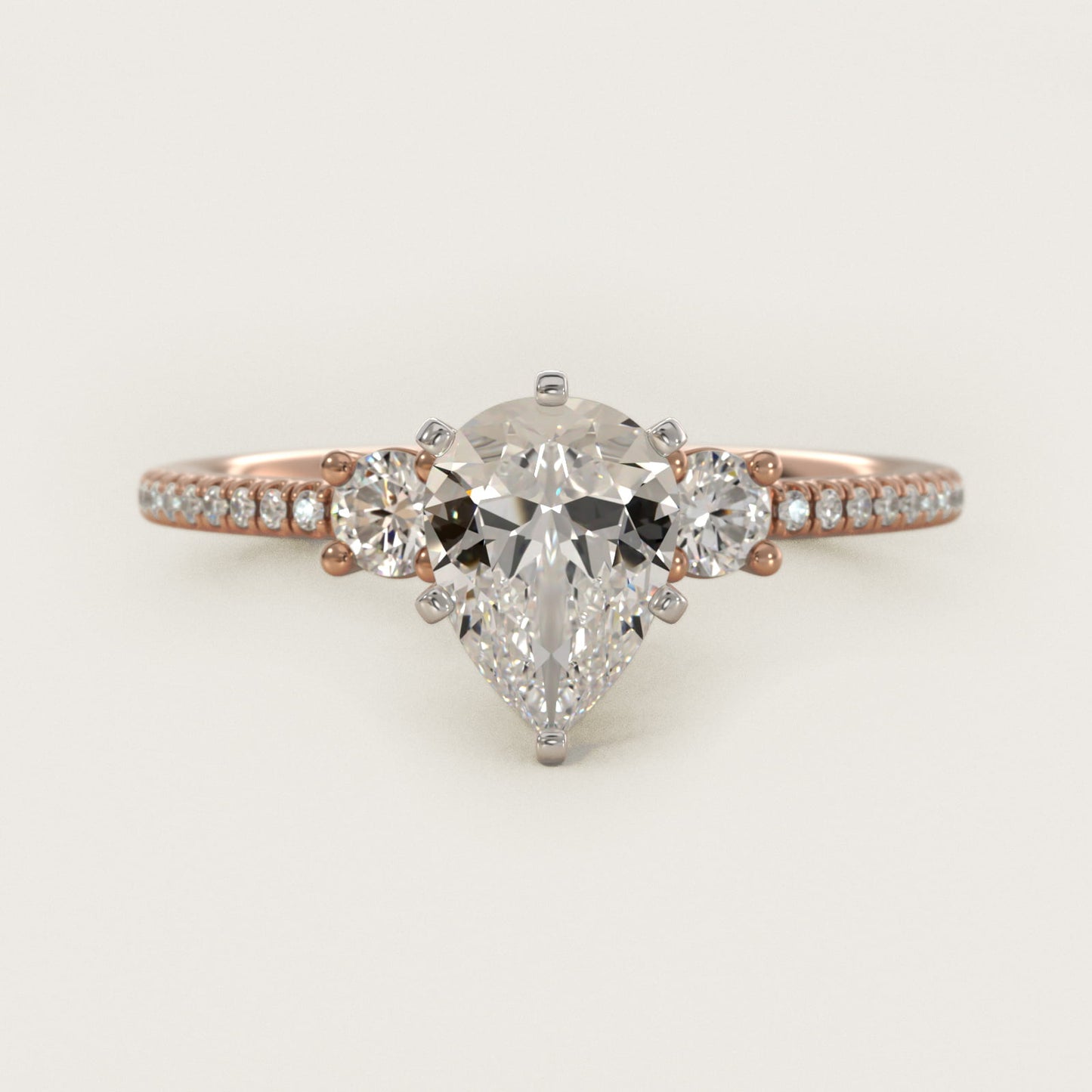 Petite MicropavŽ Trio Diamond Engagement Ring in 14k Rose Gold (1/5 ct. tw.) - Pear Center