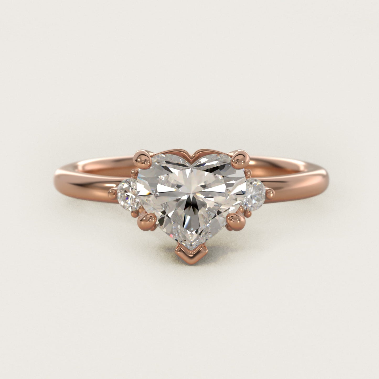 Petite Three Diamond Engagement Ring in 14k Rose Gold (1/10 ct. tw.) - Heart Center