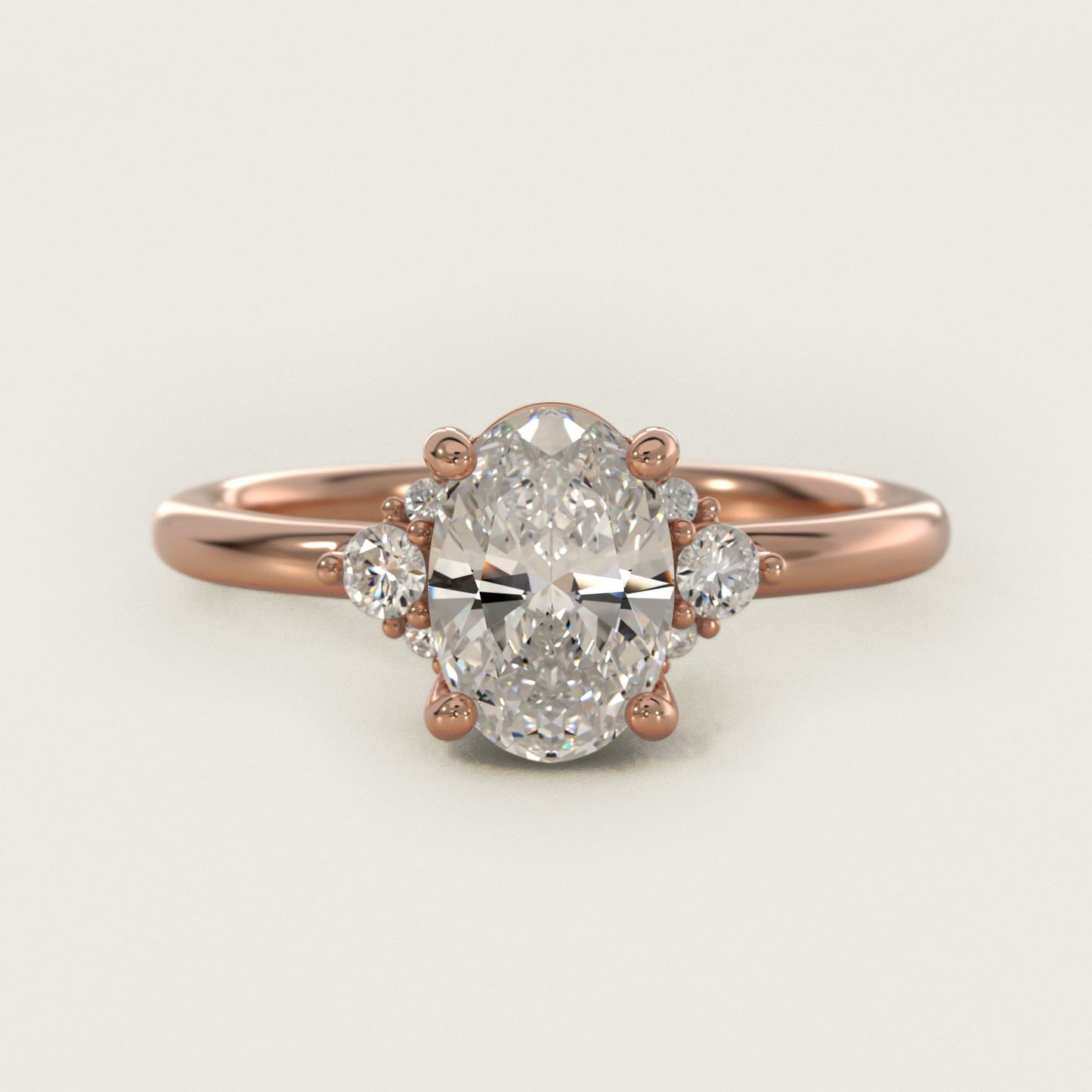 Petite Three Diamond Engagement Ring in 14k Rose Gold (1/10 ct. tw.) - Oval Center