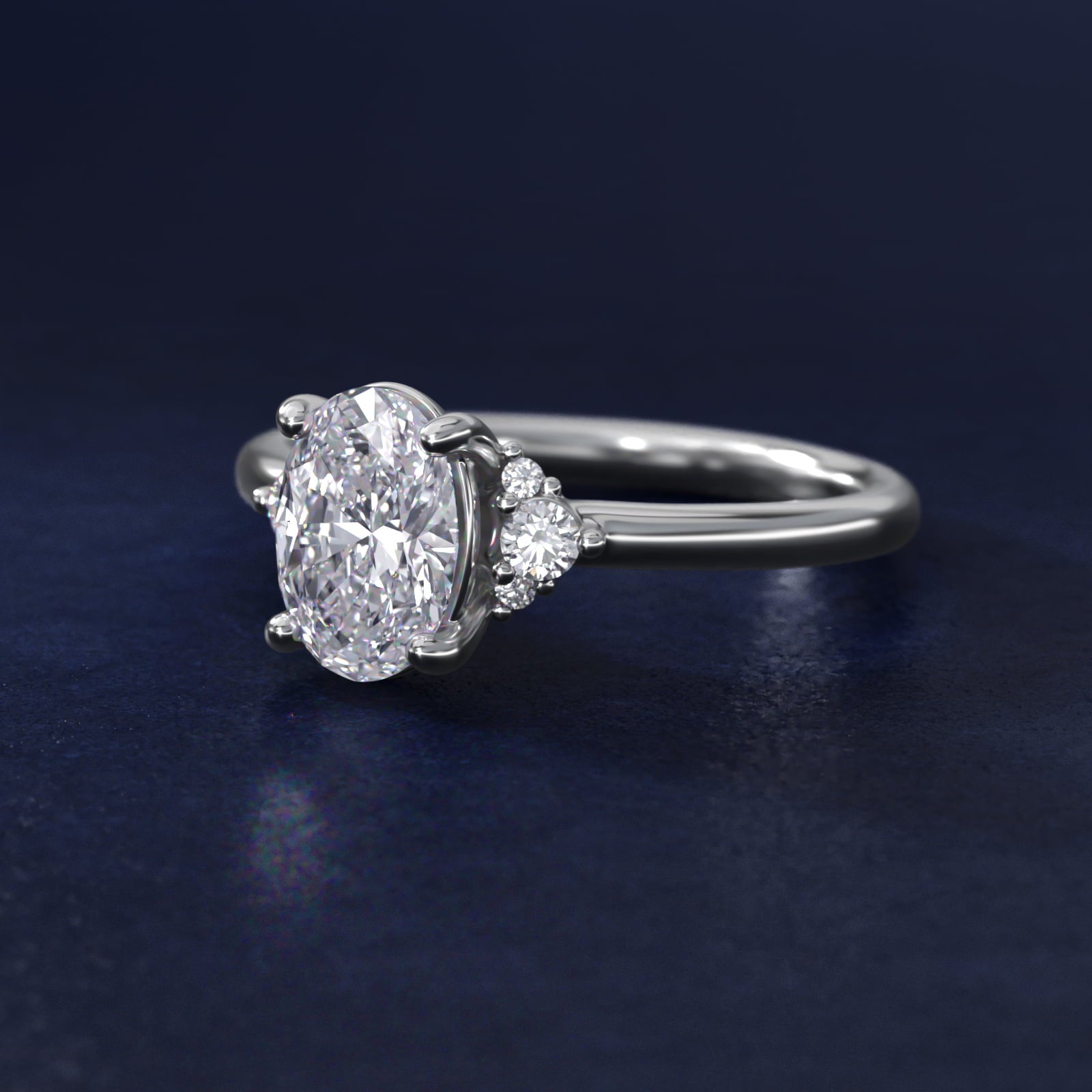 Petite Three Diamond Engagement Ring in Platinum (1/10 ct. tw.) - Oval Center