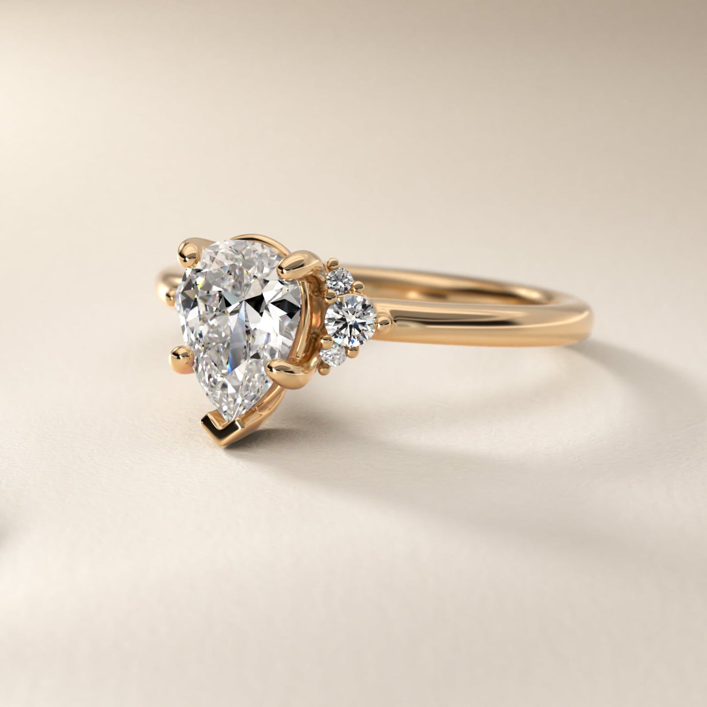 Petite Three Diamond Engagement Ring in 14k Yellow Gold (1/10 ct. tw.) - Pear Center