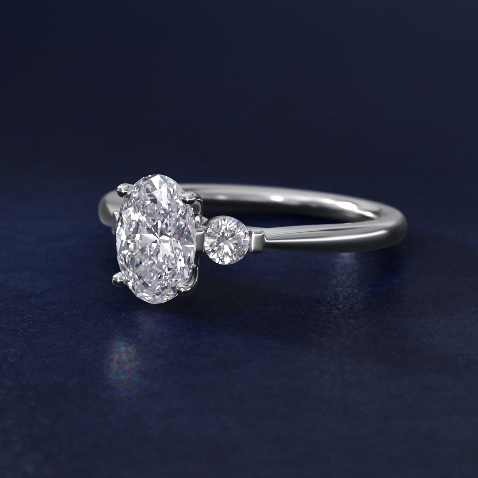 Petite Three-Stone Diamond Engagement Ring in 18k White Gold - Oval Center