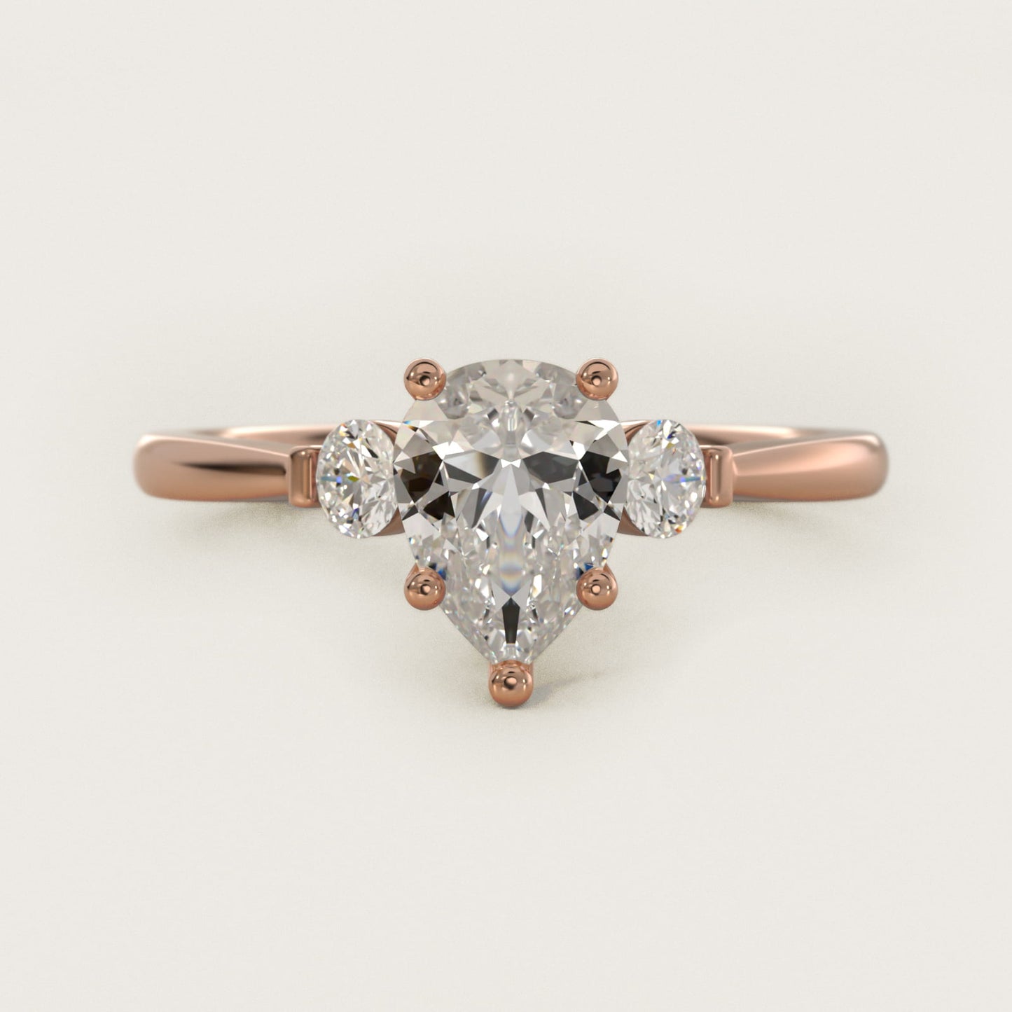 Petite Three-Stone Diamond Engagement Ring in 18k Rose Gold - Pear Center