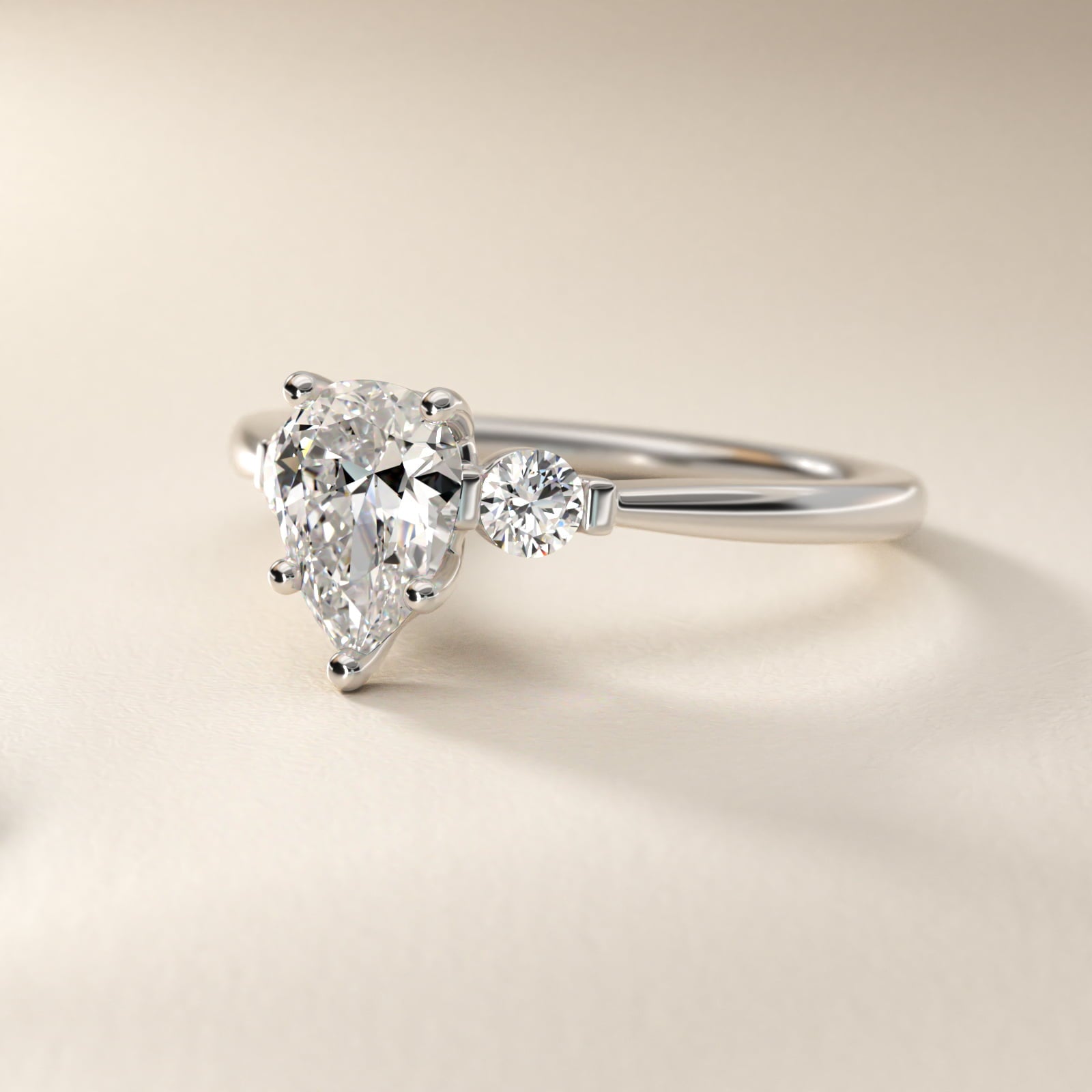 Petite Three-Stone Diamond Engagement Ring in Platinum - Pear Center