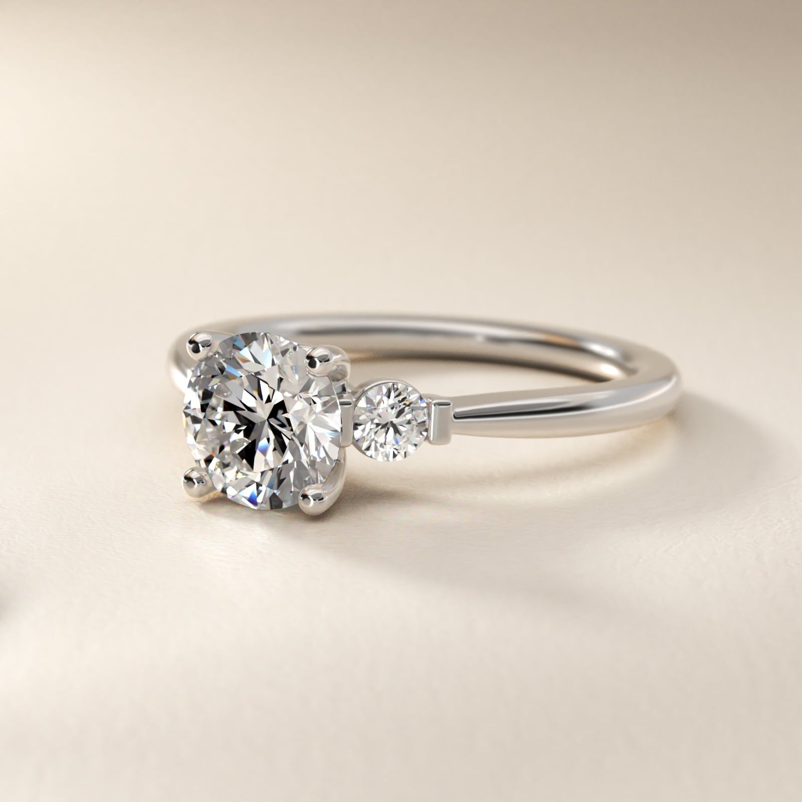 Petite Three-Stone Diamond Engagement Ring in Platinum - Round Center