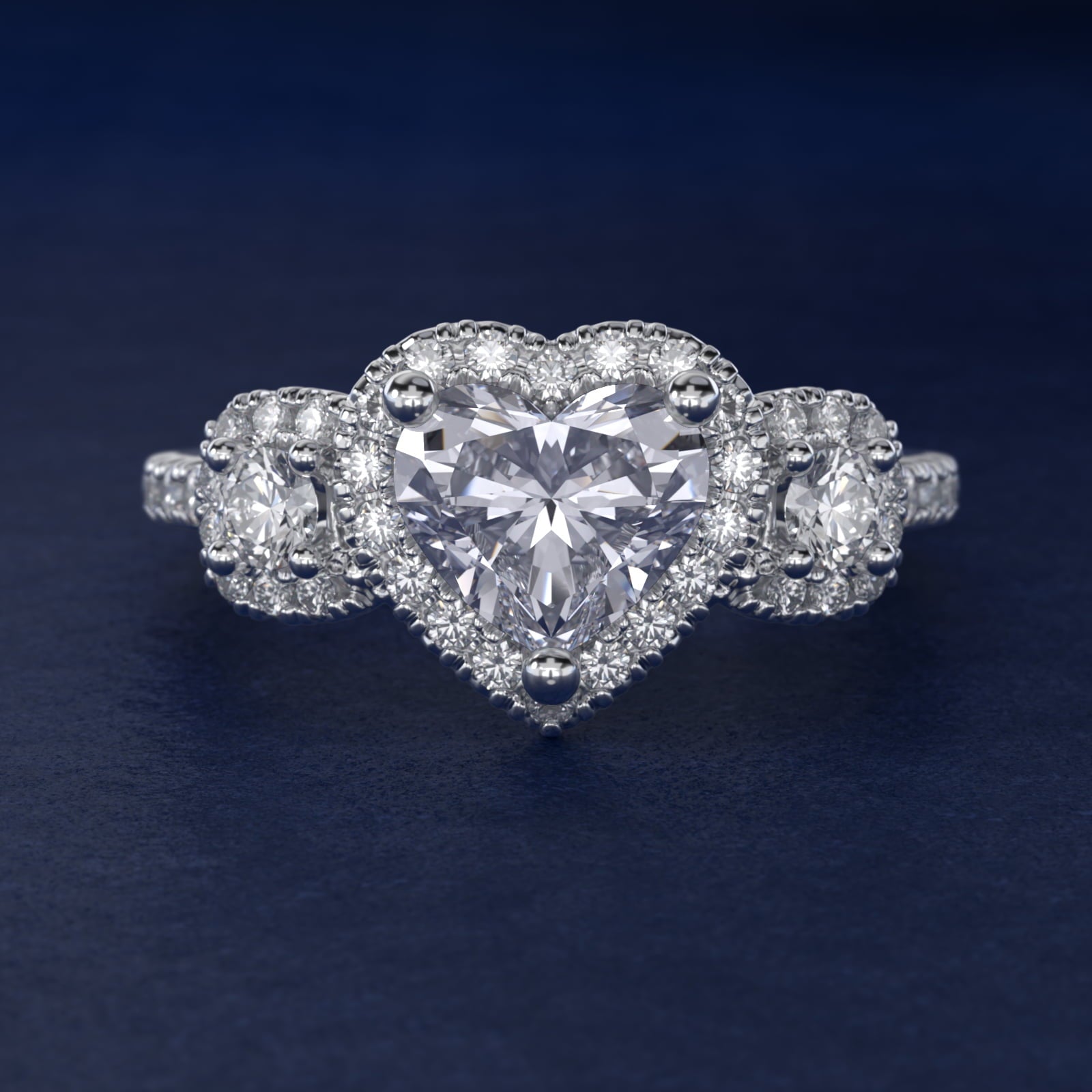 Three-Stone Cushion Halo Diamond Engagement Ring in Platinum - Heart Center