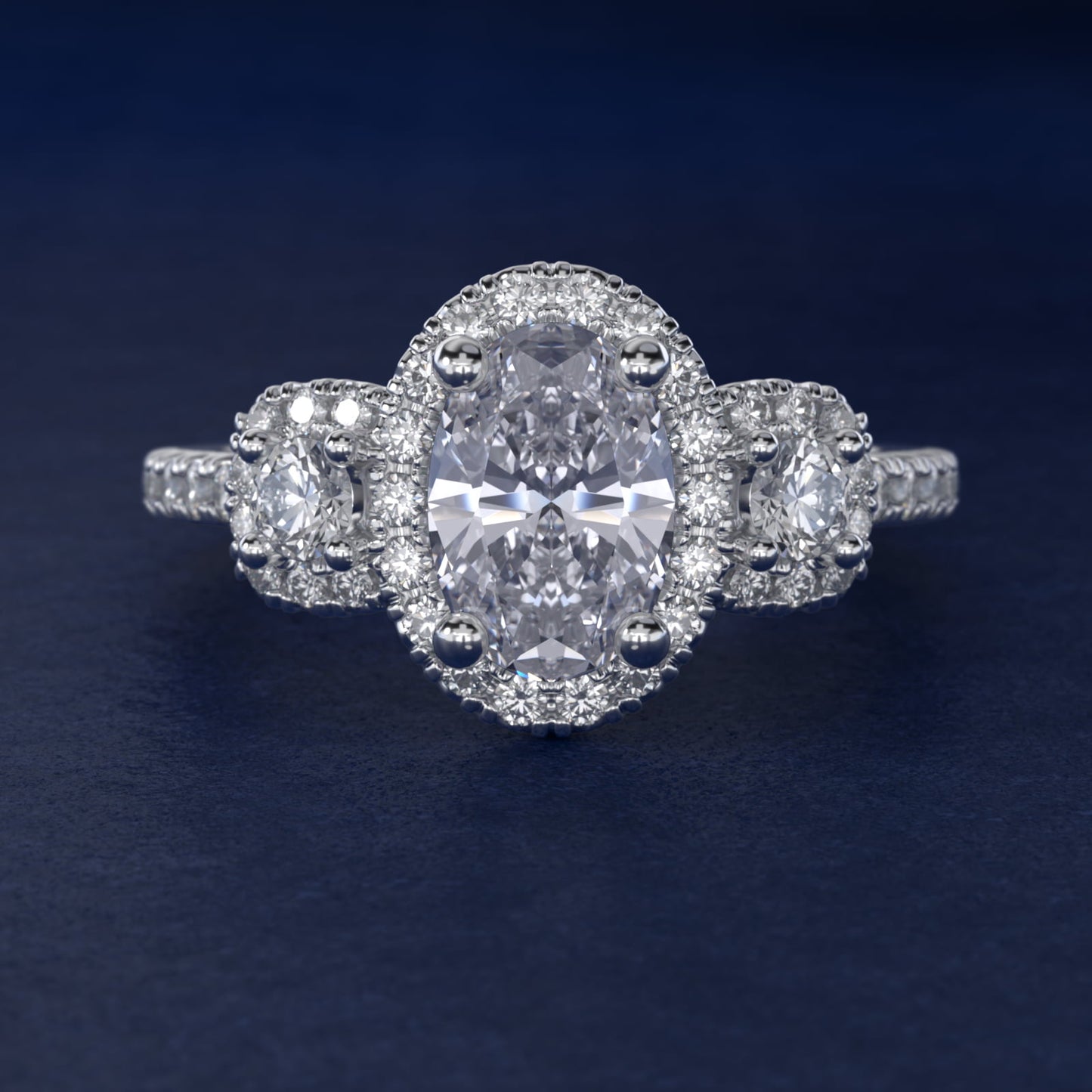 Three-Stone Cushion Halo Diamond Engagement Ring in Platinum - Oval Center