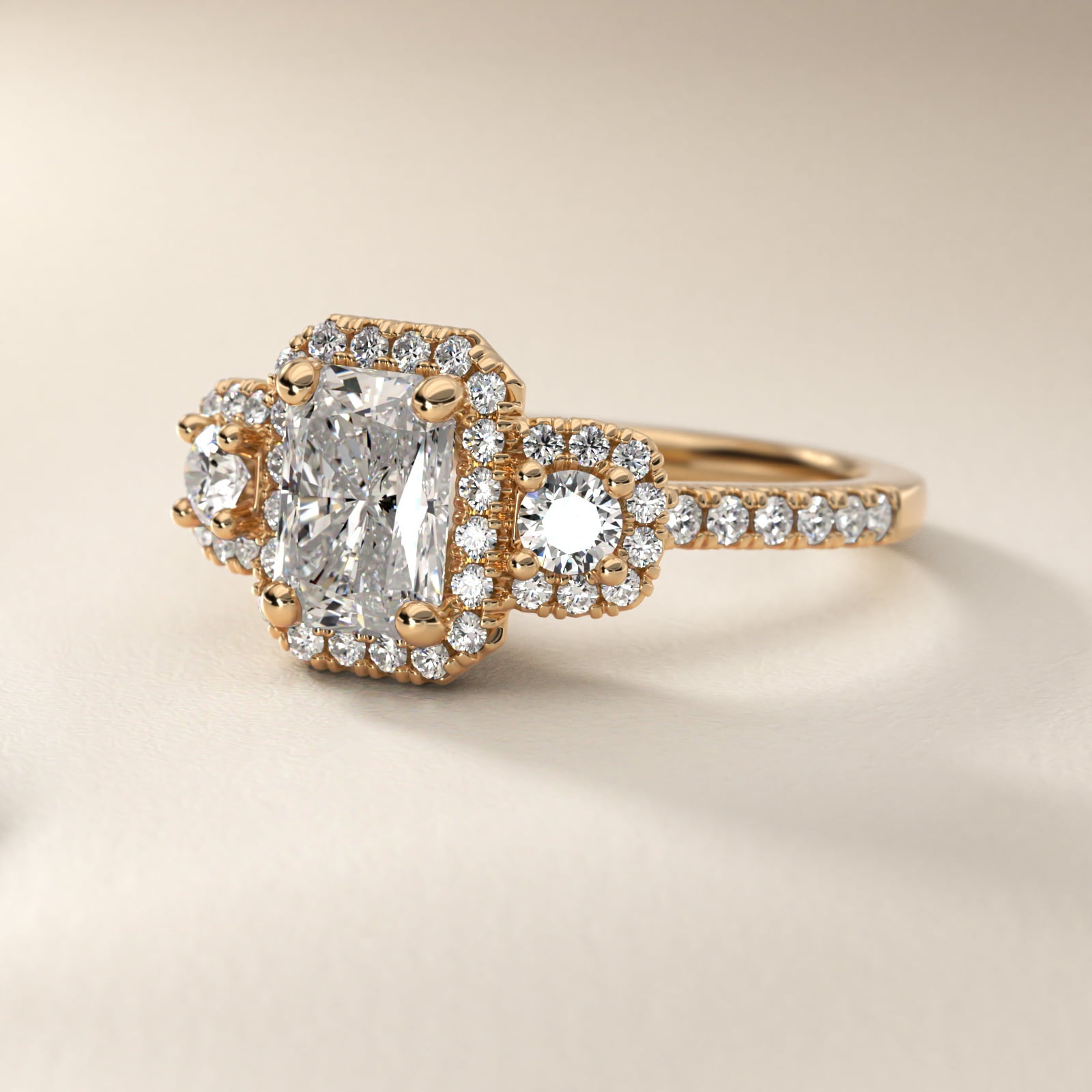 Three-Stone Cushion Halo Diamond Engagement Ring in 18k Yellow Gold - Radiant Center