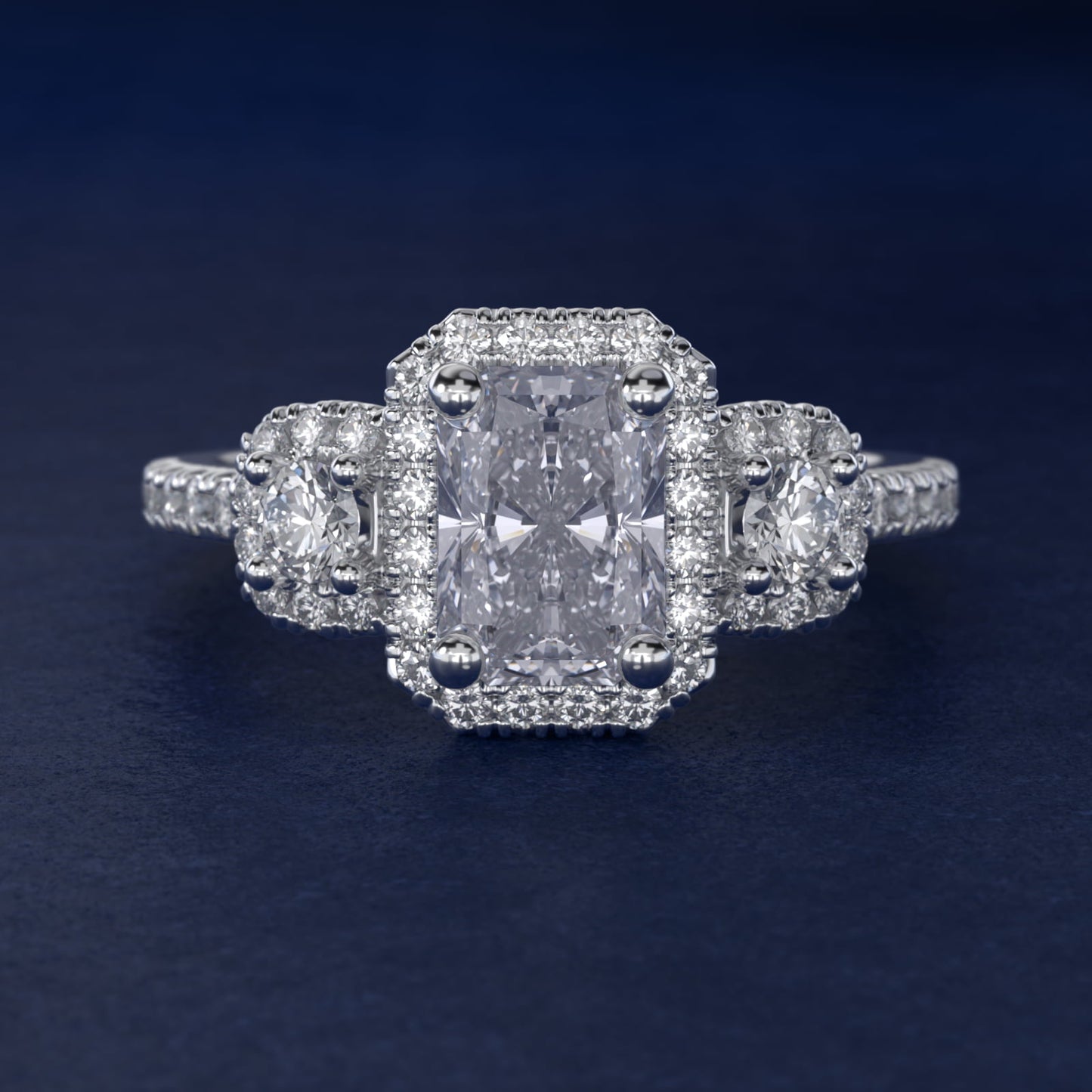 Three-Stone Cushion Halo Diamond Engagement Ring in Platinum - Radiant Center