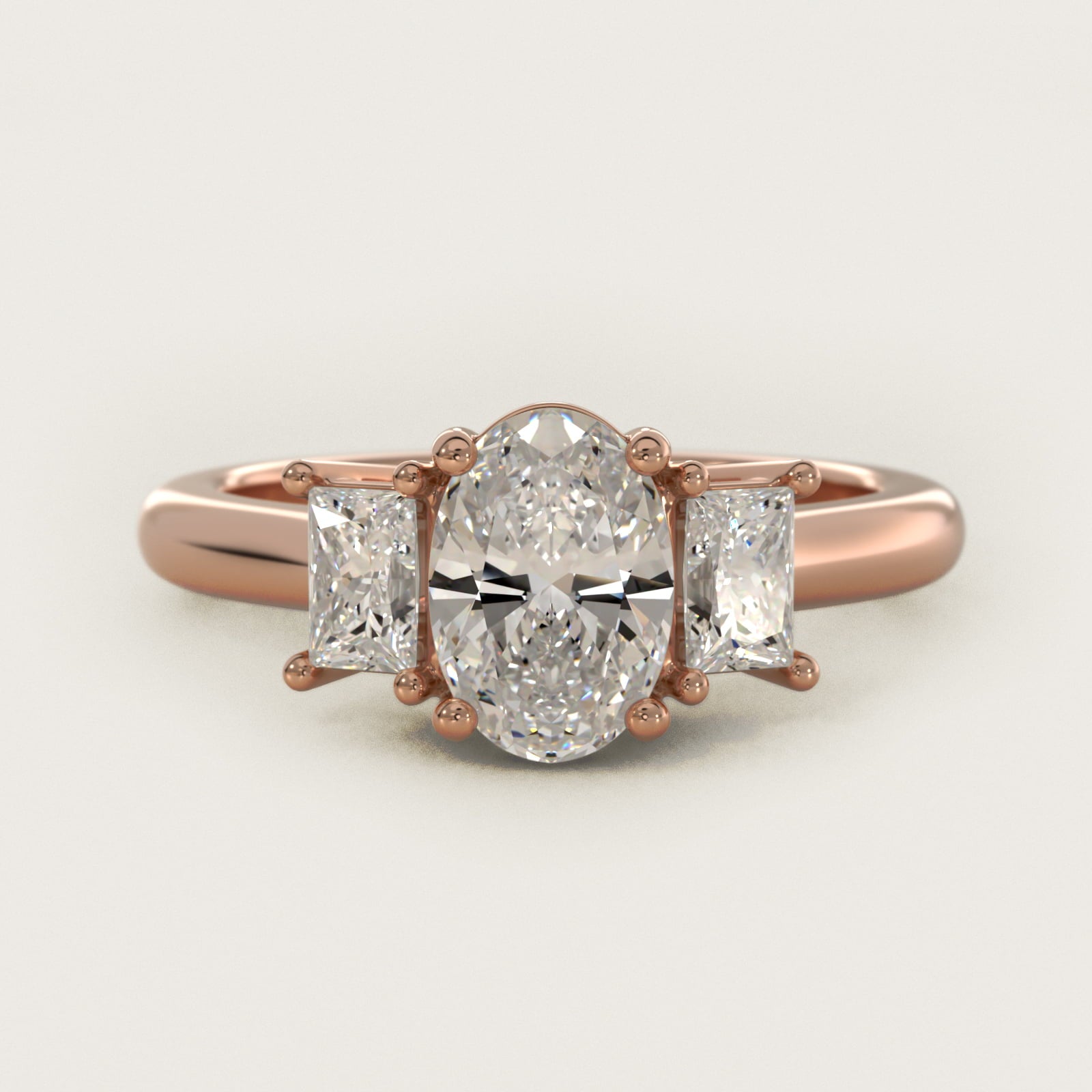 Three-Stone Elongated Princess Diamond Engagement Ring in 14k Rose Gold (1/2 ct. tw.) - Oval Center
