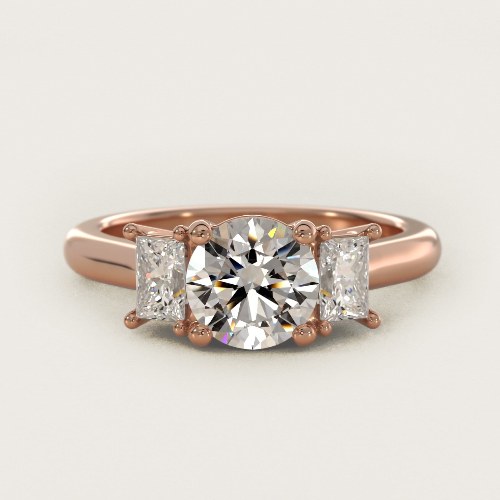 Three-Stone Elongated Princess Diamond Engagement Ring in 14k Rose Gold (1/2 ct. tw.) - Round Center