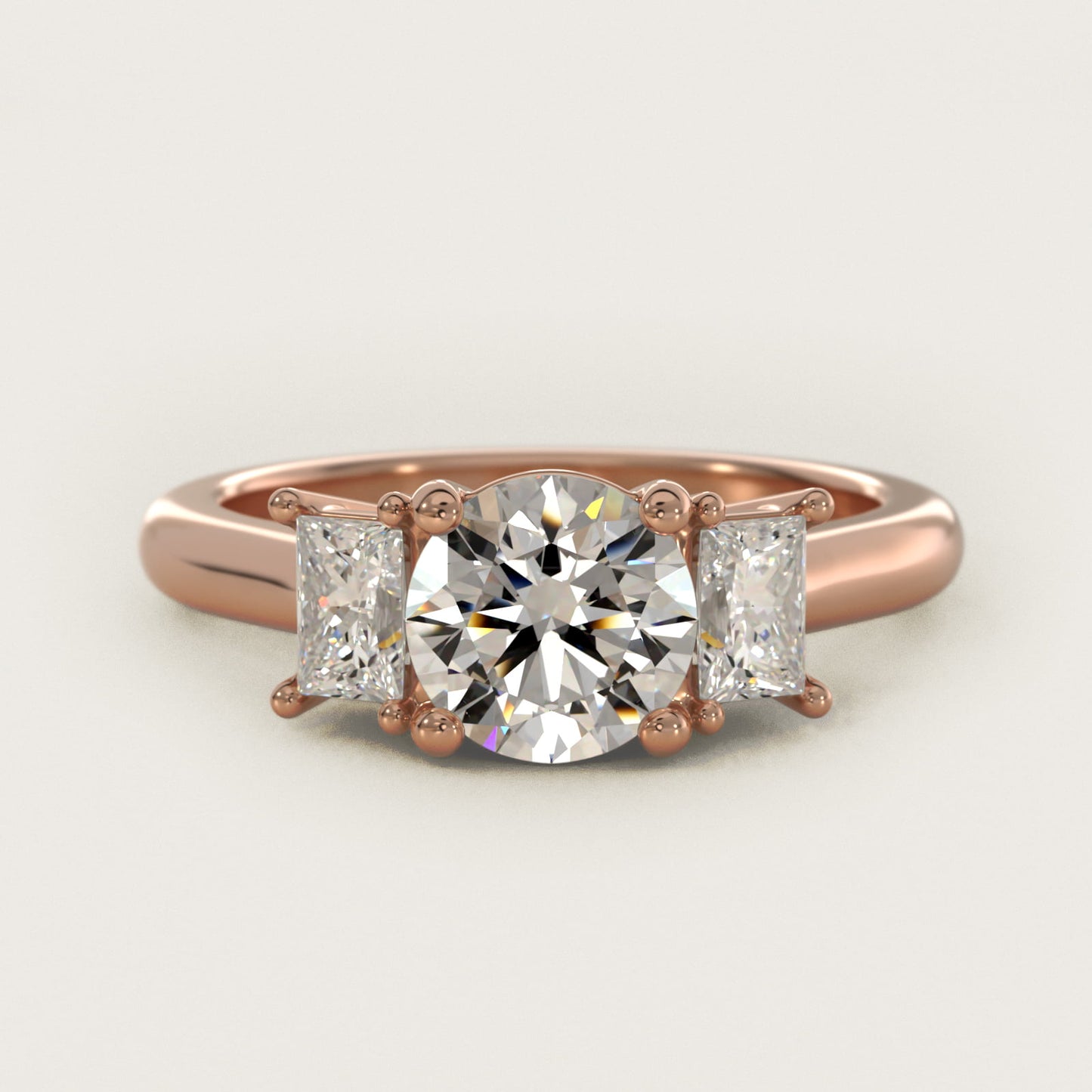 Three-Stone Elongated Princess Diamond Engagement Ring in 18k Rose Gold (1/2 ct. tw.) - Round Center