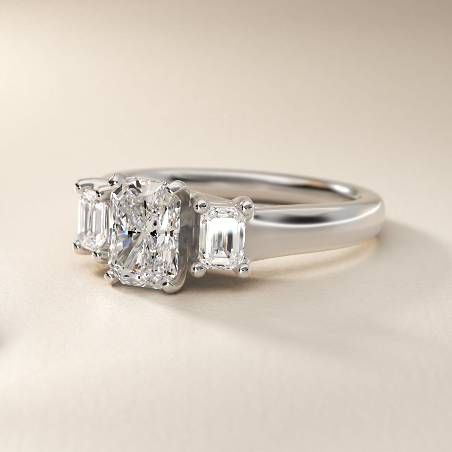 Three-Stone Emerald-Cut Diamond Engagement Ring in Platinum (1/3 ct tw.) By Zac Zac Posen - Radiant Center