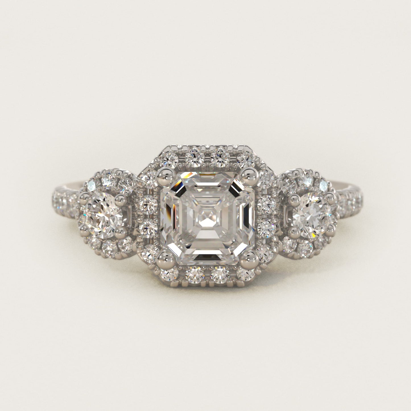 Three-Stone Halo Diamond Engagement Ring in Platinum - Asscher Center