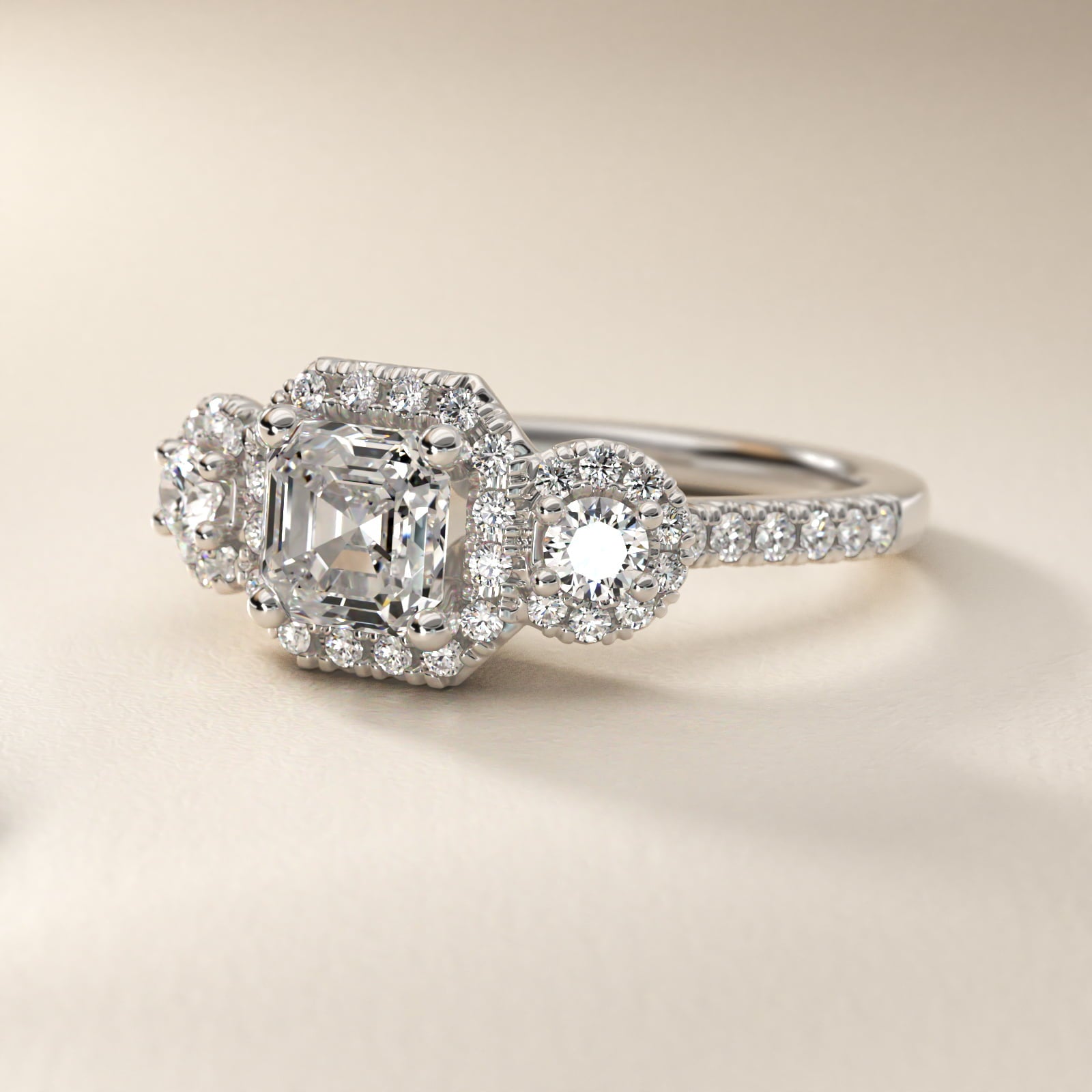Three-Stone Halo Diamond Engagement Ring in Platinum - Asscher Center