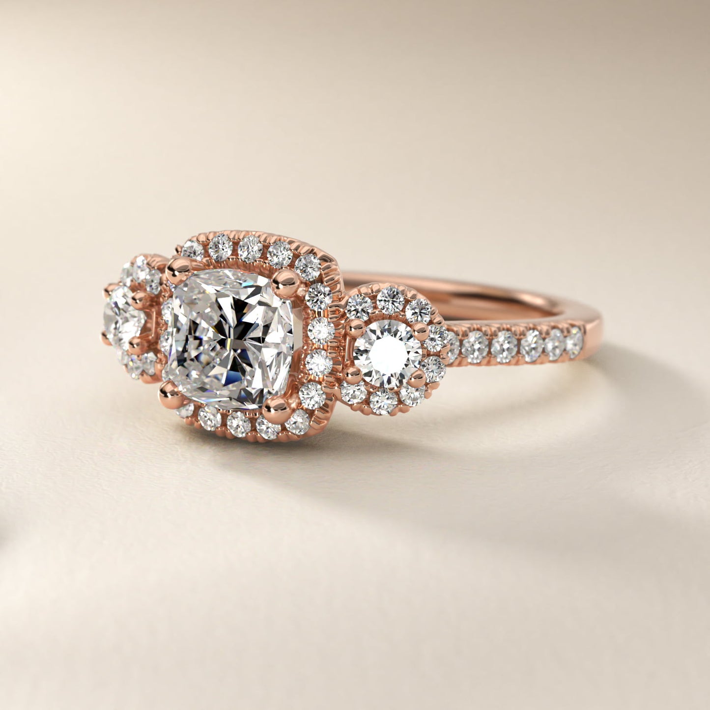 Three-Stone Halo Diamond Engagement Ring in 18k Rose Gold - Cushion Center