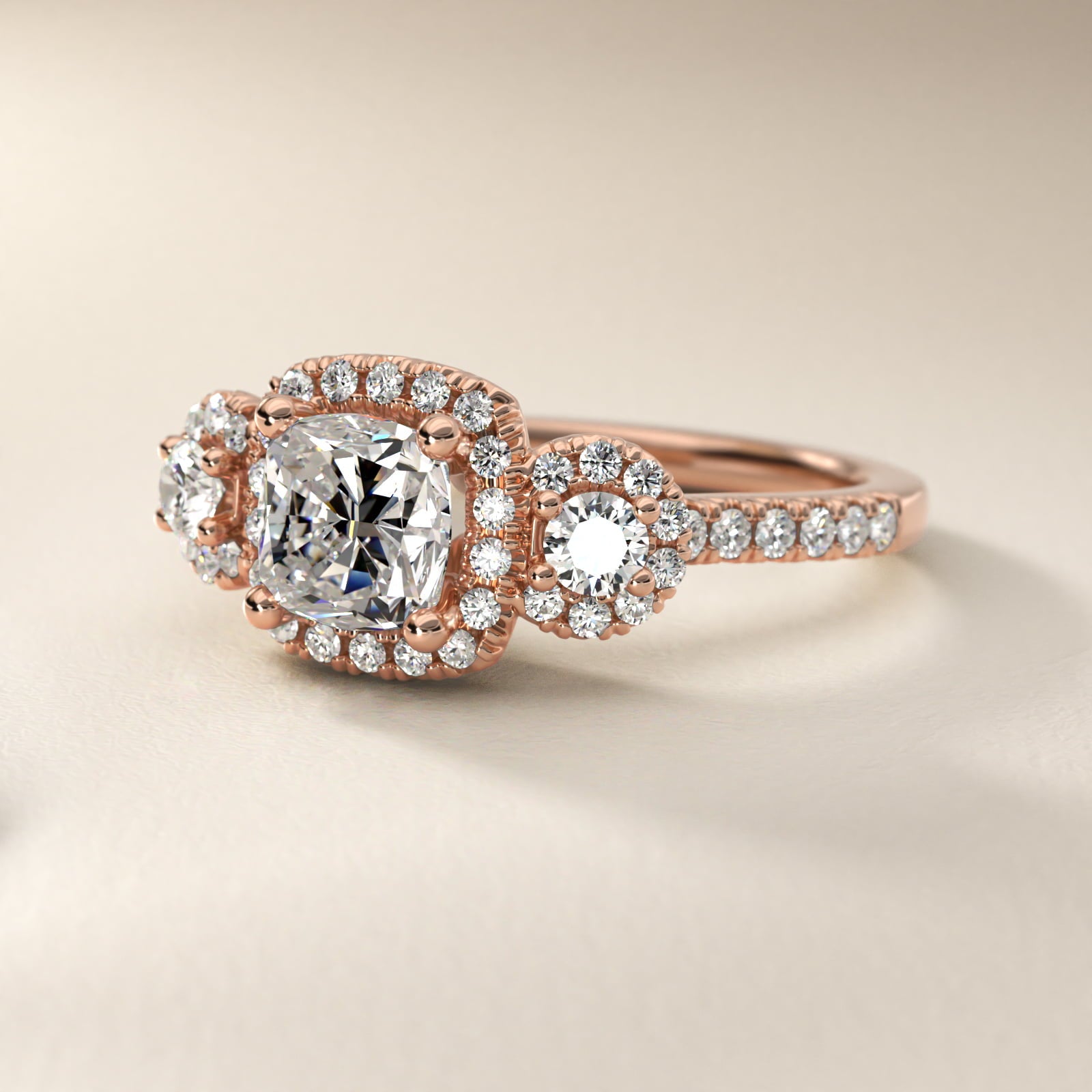 Three-Stone Halo Diamond Engagement Ring in 18k Rose Gold - Cushion Center