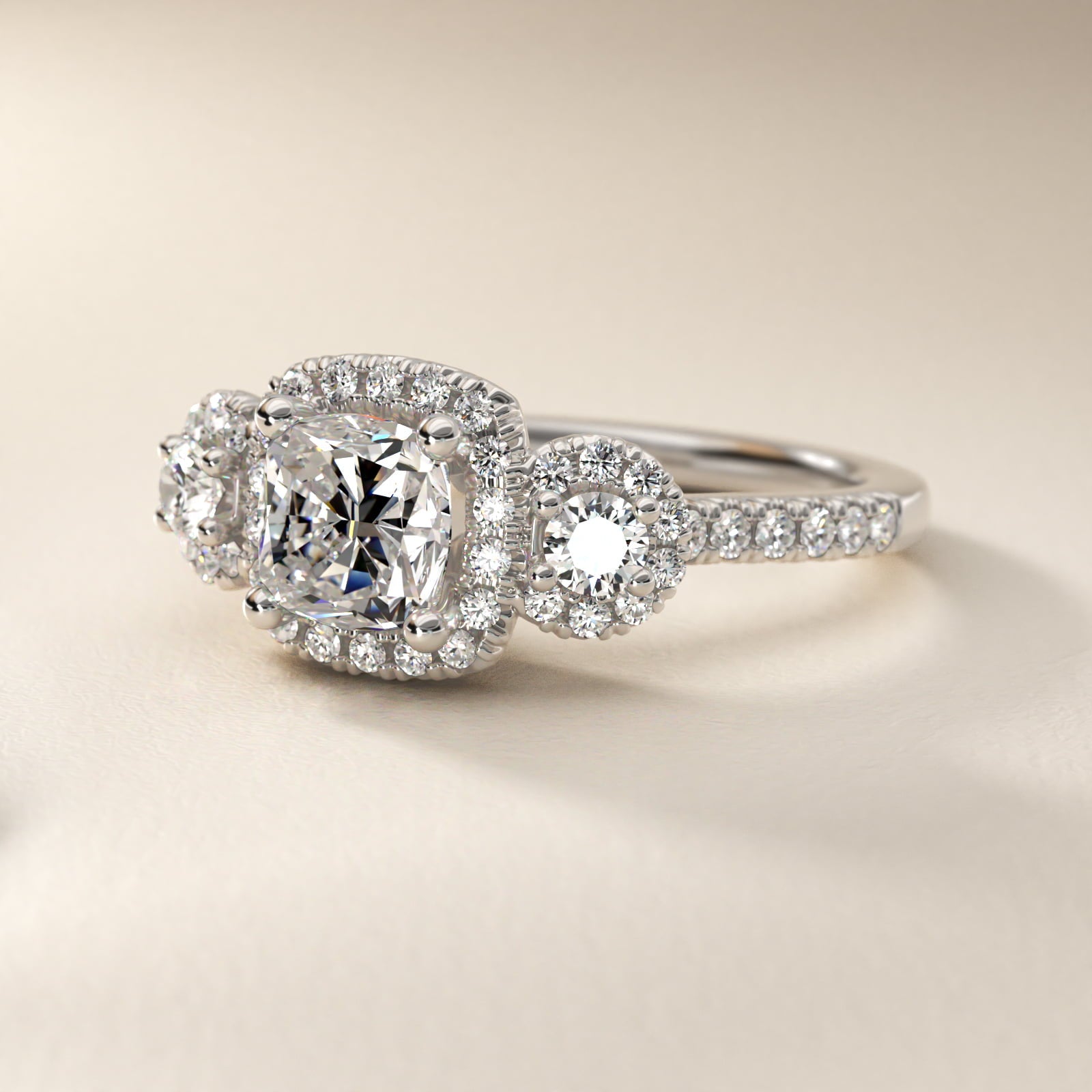Three-Stone Halo Diamond Engagement Ring in Platinum - Cushion Center