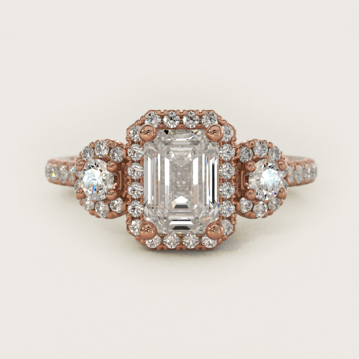 Three-Stone Halo Diamond Engagement Ring in 18k Rose Gold - Emerald Center