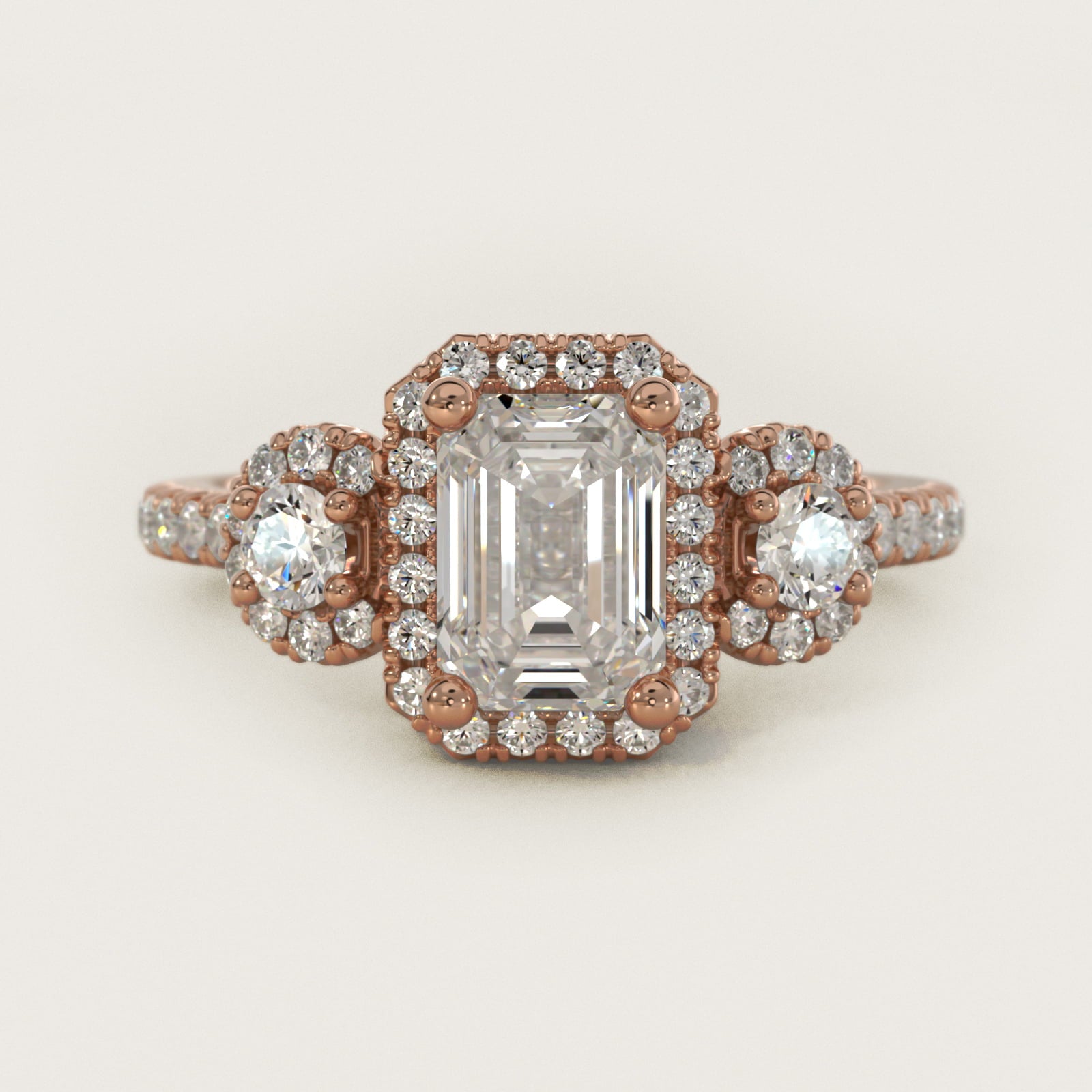 Three-Stone Halo Diamond Engagement Ring in 18k Rose Gold - Emerald Center