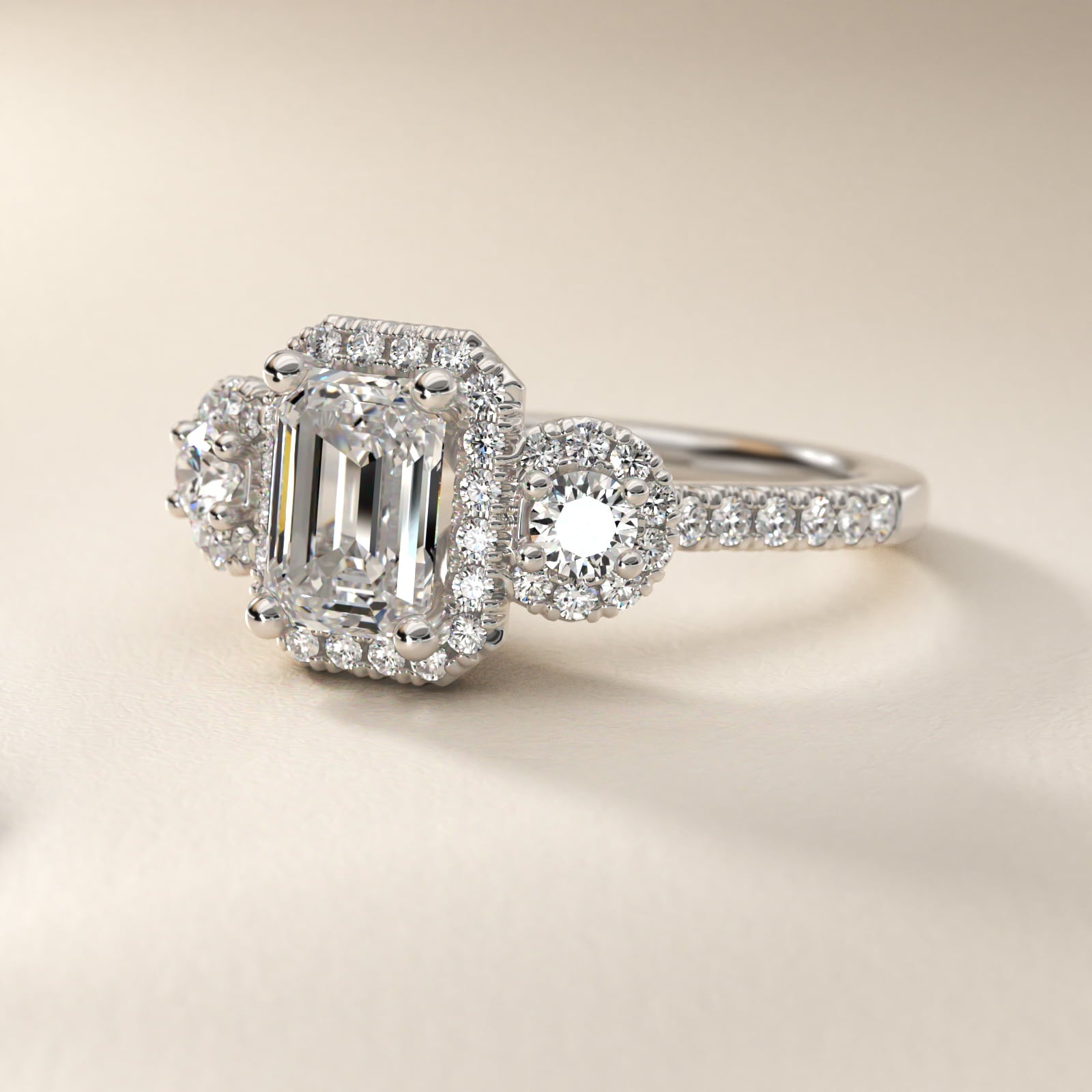 Three-Stone Halo Diamond Engagement Ring in Platinum - Emerald Center
