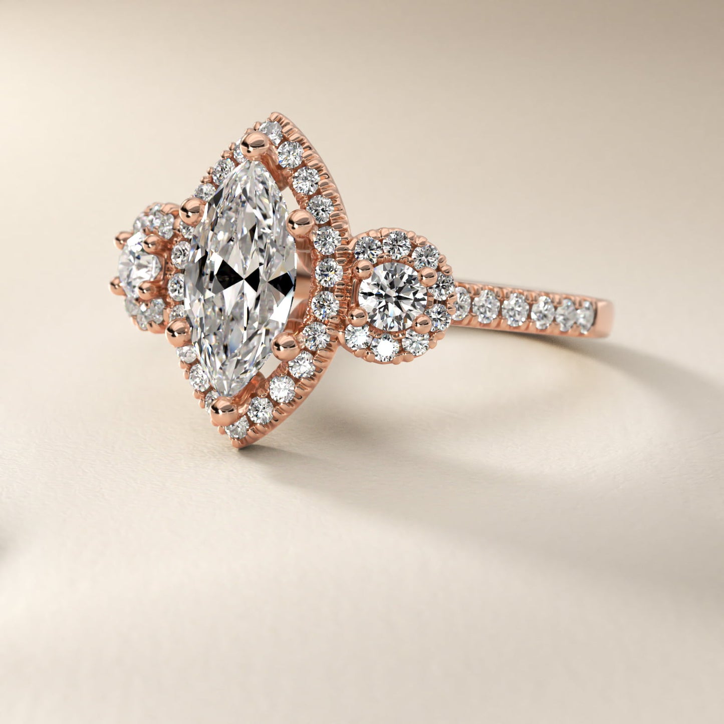 Three-Stone Halo Diamond Engagement Ring in 18k Rose Gold - Marquise Center