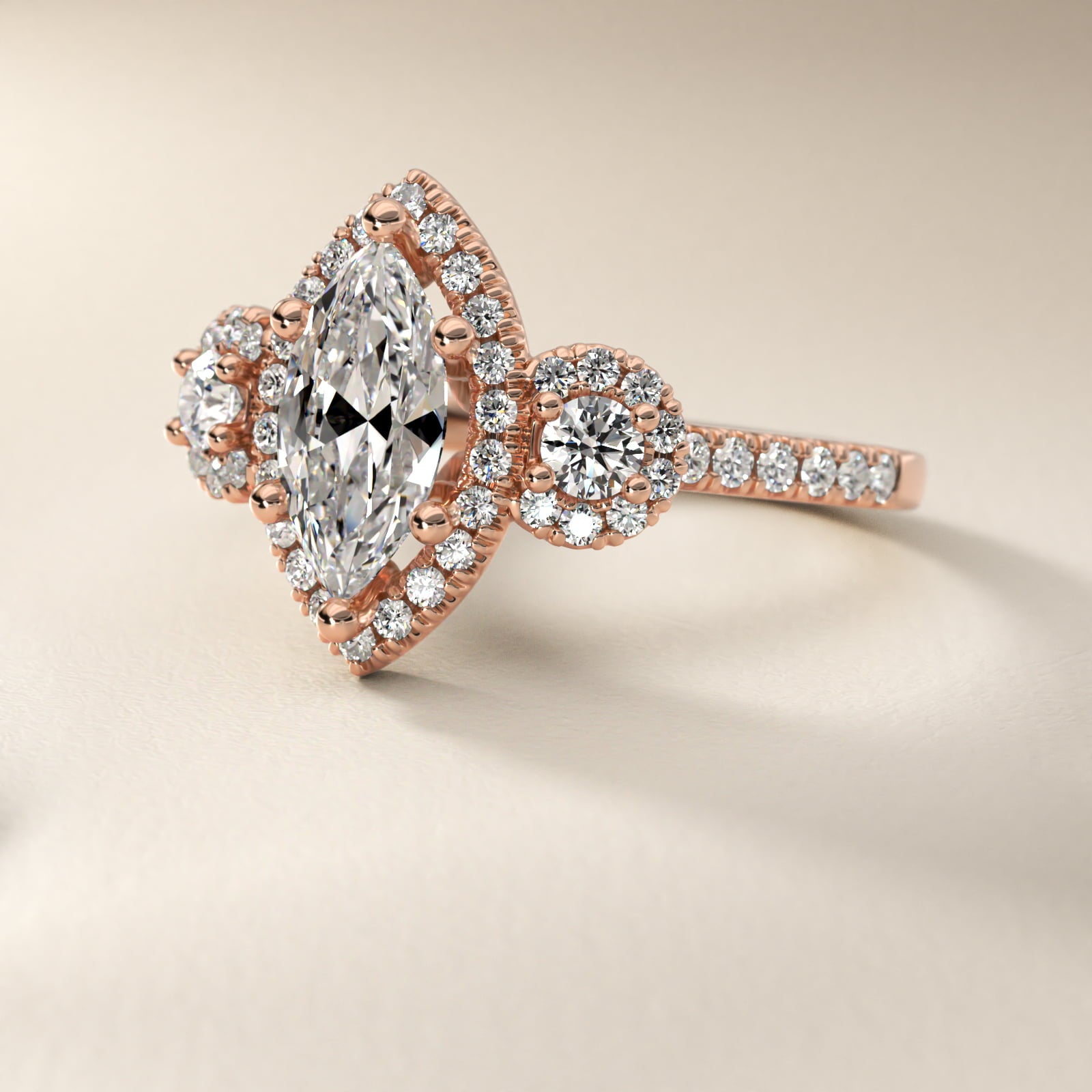 Three-Stone Halo Diamond Engagement Ring in 18k Rose Gold - Marquise Center