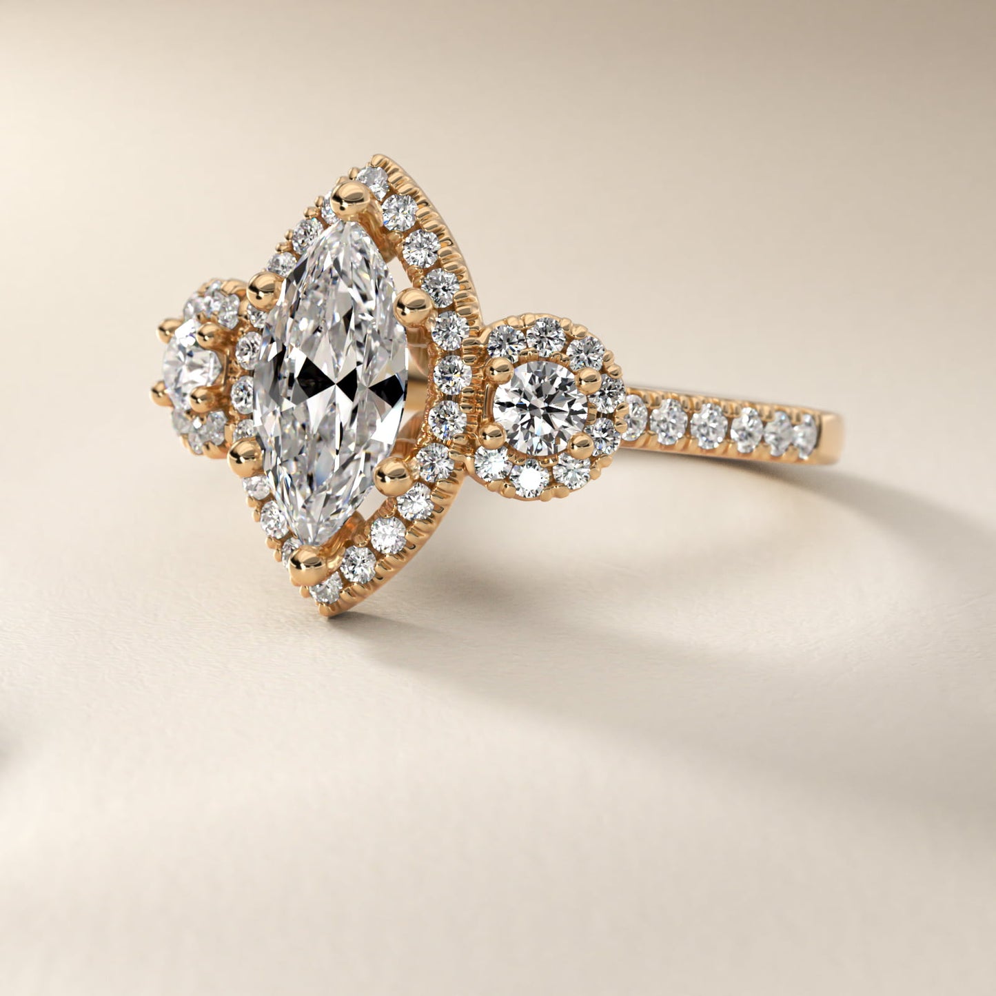 Three-Stone Halo Diamond Engagement Ring in 18k Yellow Gold - Marquise Center