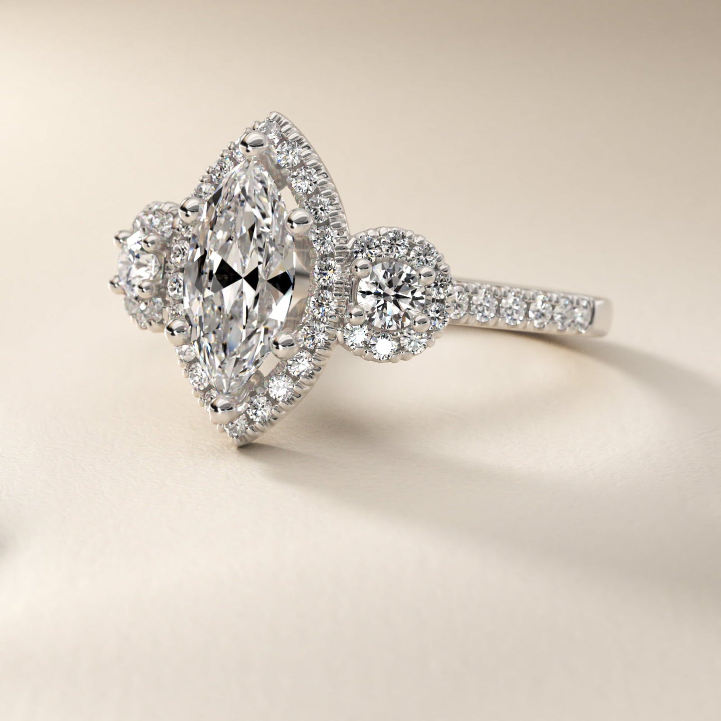 Three-Stone Halo Diamond Engagement Ring in Platinum - Marquise Center