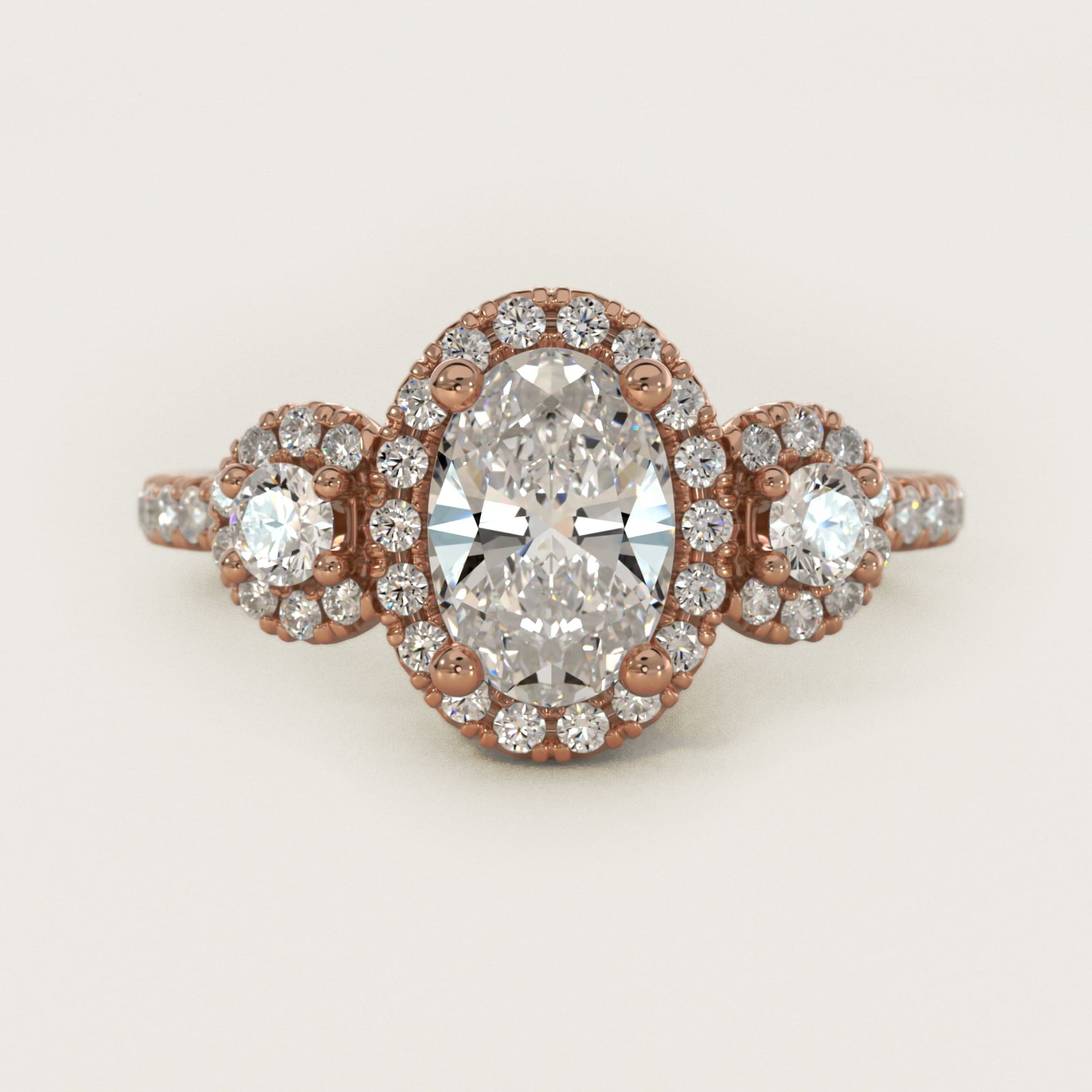 Three-Stone Halo Diamond Engagement Ring in 18k Rose Gold - Oval Center