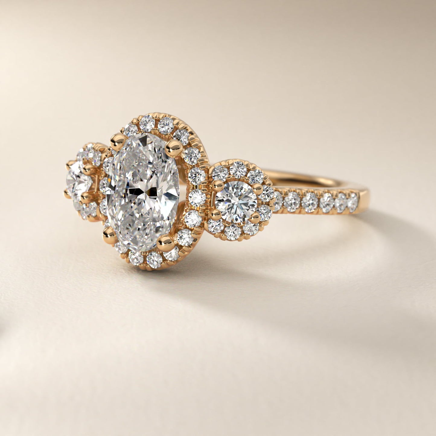 Three-Stone Halo Diamond Engagement Ring in 18k Yellow Gold - Oval Center