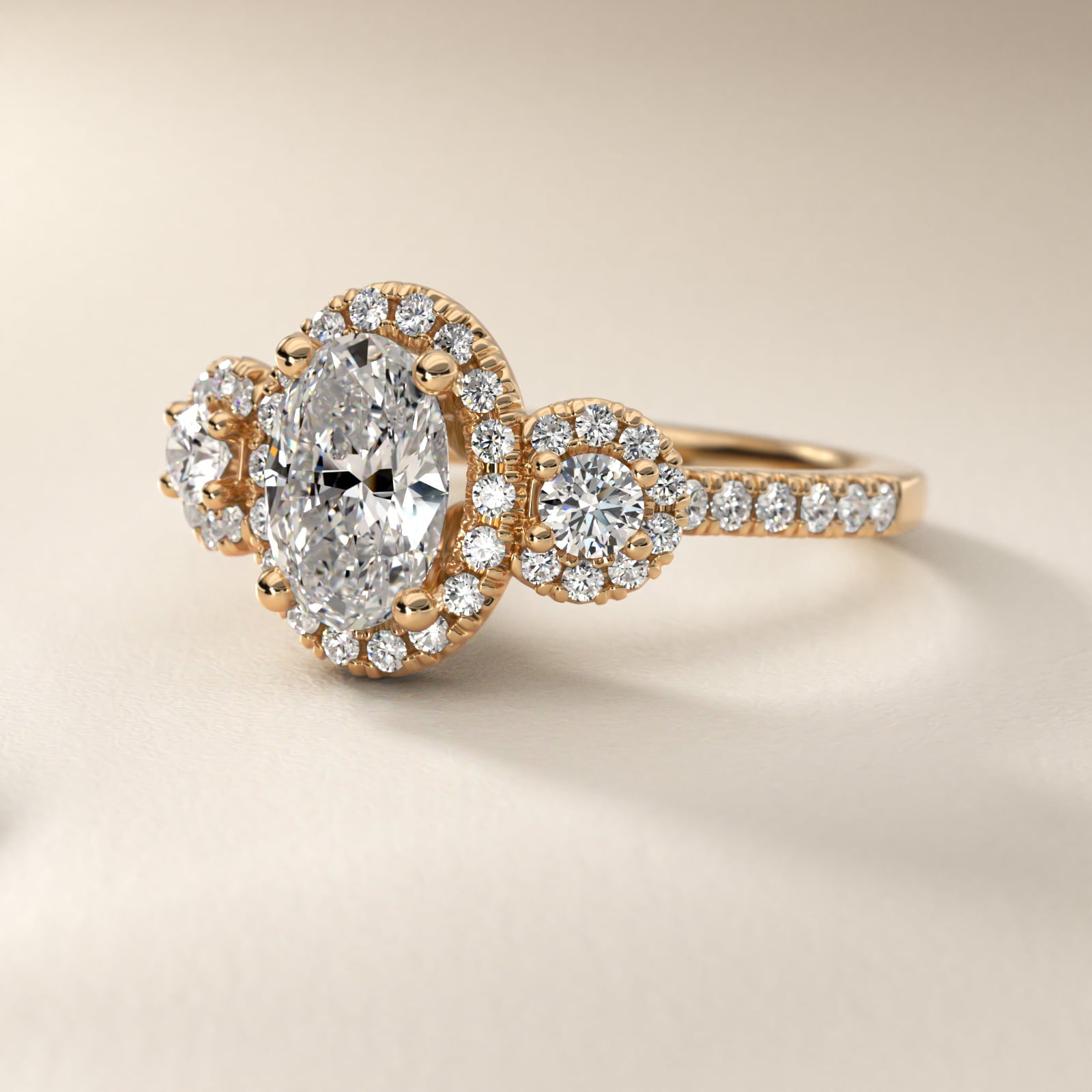 Three-Stone Halo Diamond Engagement Ring in 18k Yellow Gold - Oval Center