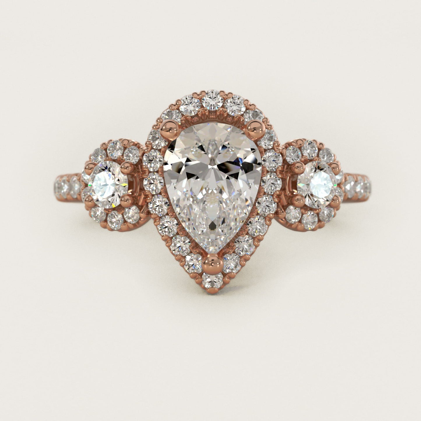 Three-Stone Halo Diamond Engagement Ring in 18k Rose Gold - Pear Center