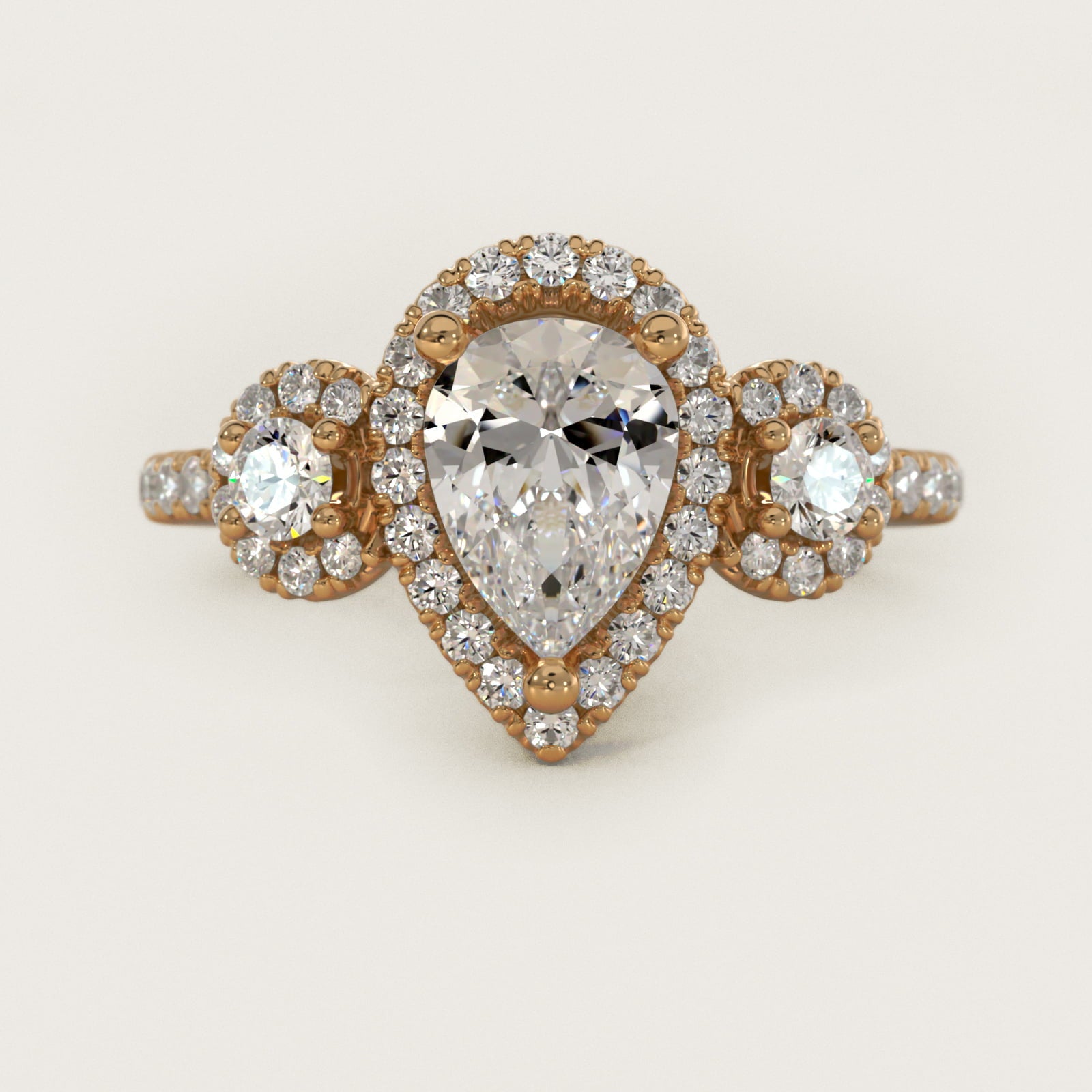 Three-Stone Halo Diamond Engagement Ring in 14k Yellow Gold - Pear Center