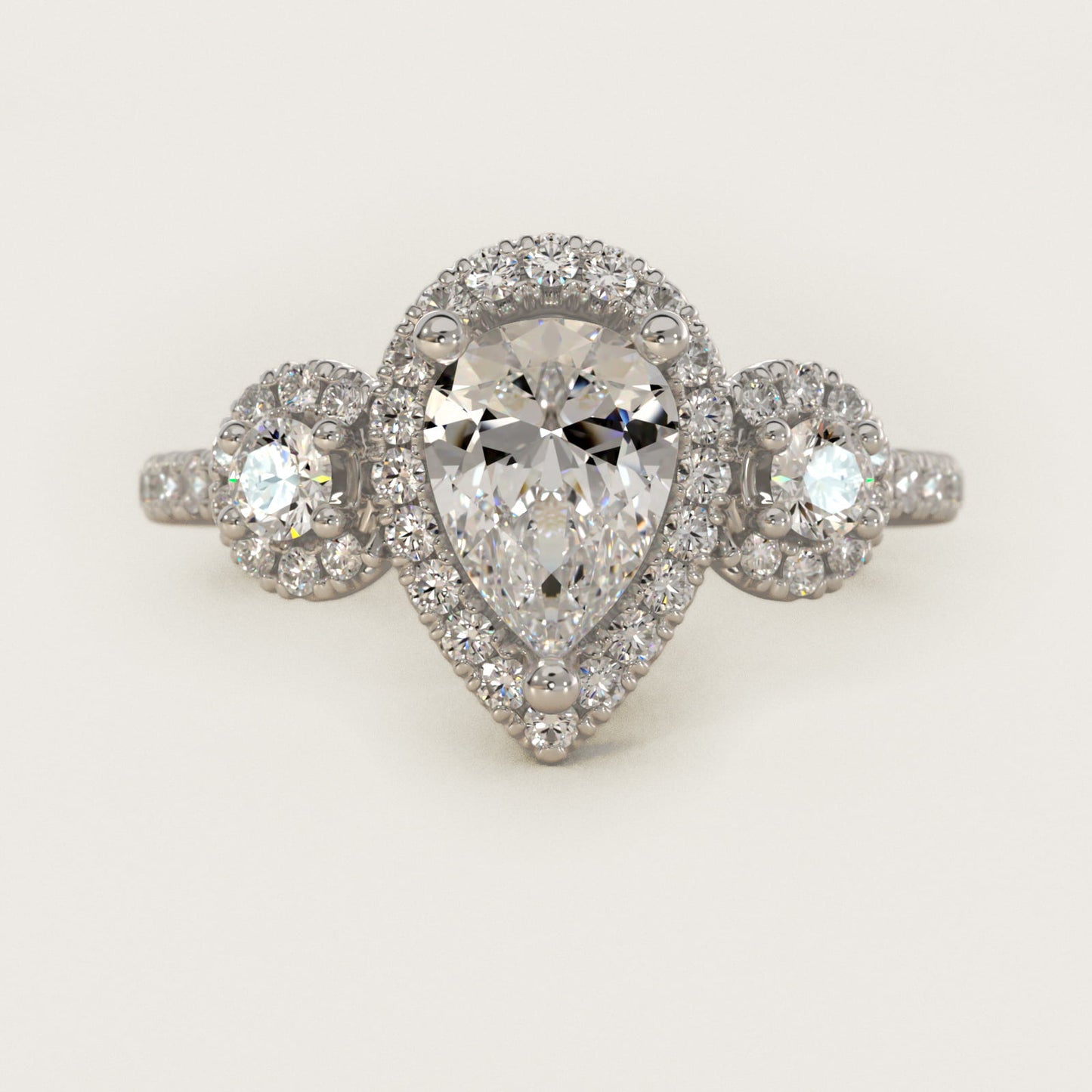Three-Stone Halo Diamond Engagement Ring in Platinum - Pear Center