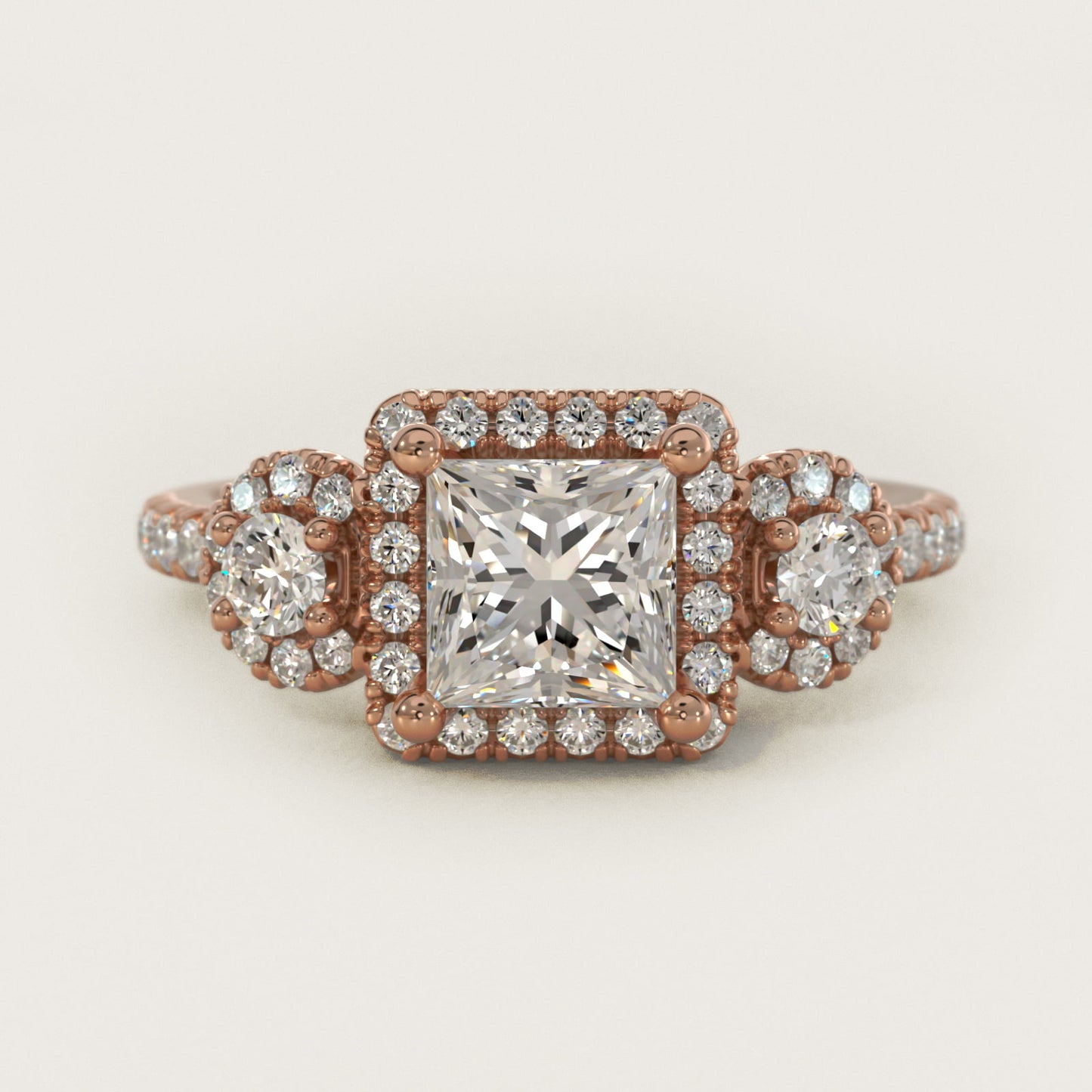 Three-Stone Halo Diamond Engagement Ring in 18k Rose Gold - Princess Center