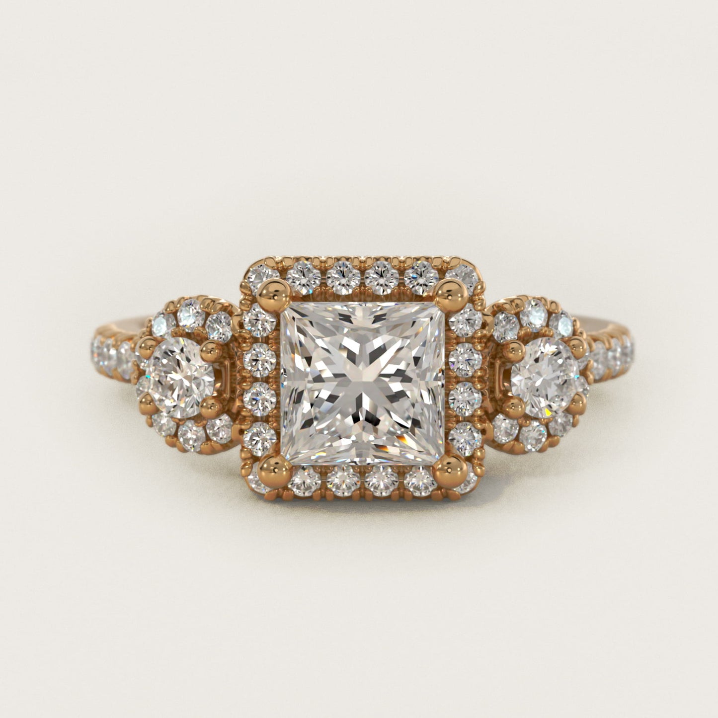 Three-Stone Halo Diamond Engagement Ring in 14k Yellow Gold - Princess Center
