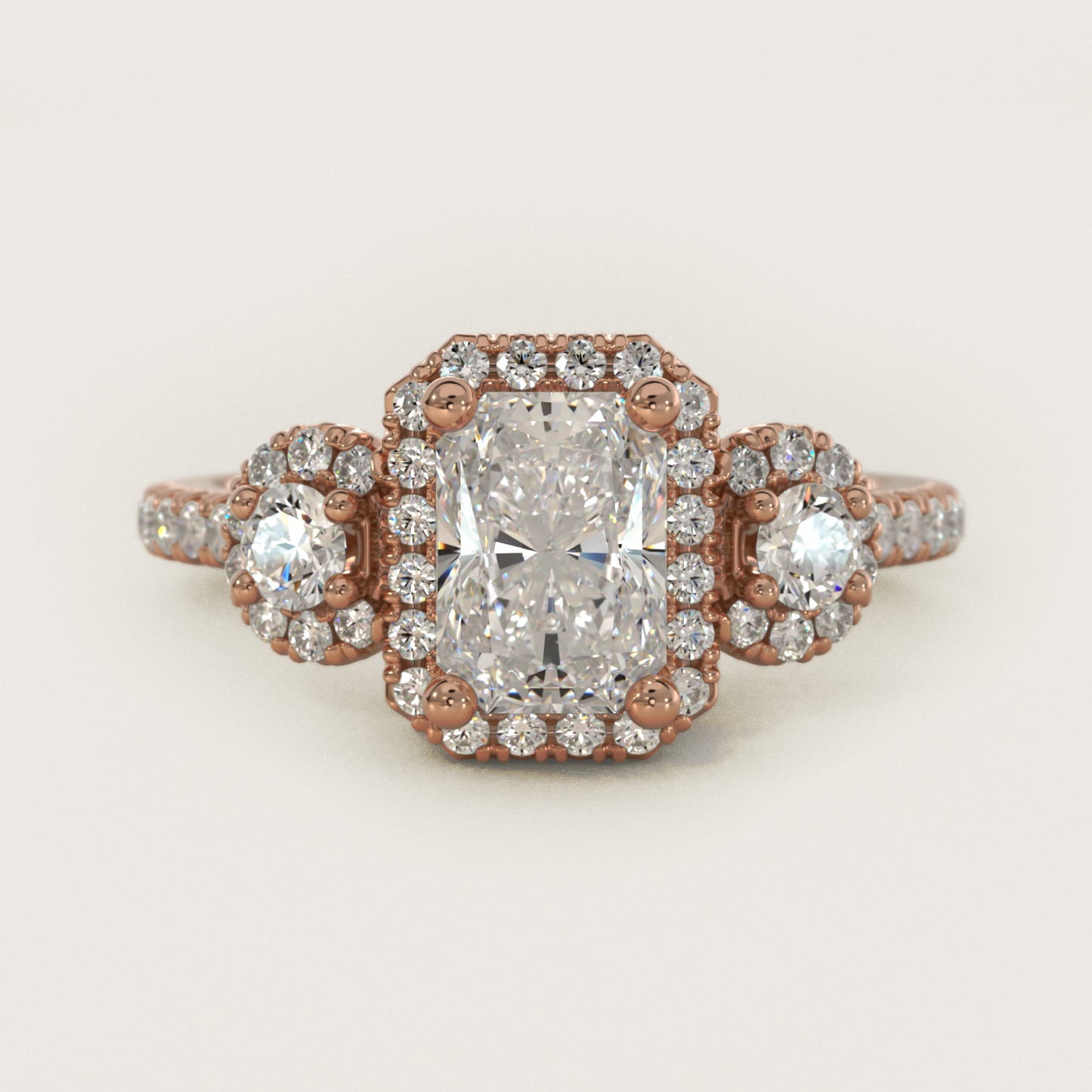 Three-Stone Halo Diamond Engagement Ring in 18k Rose Gold - Radiant Center