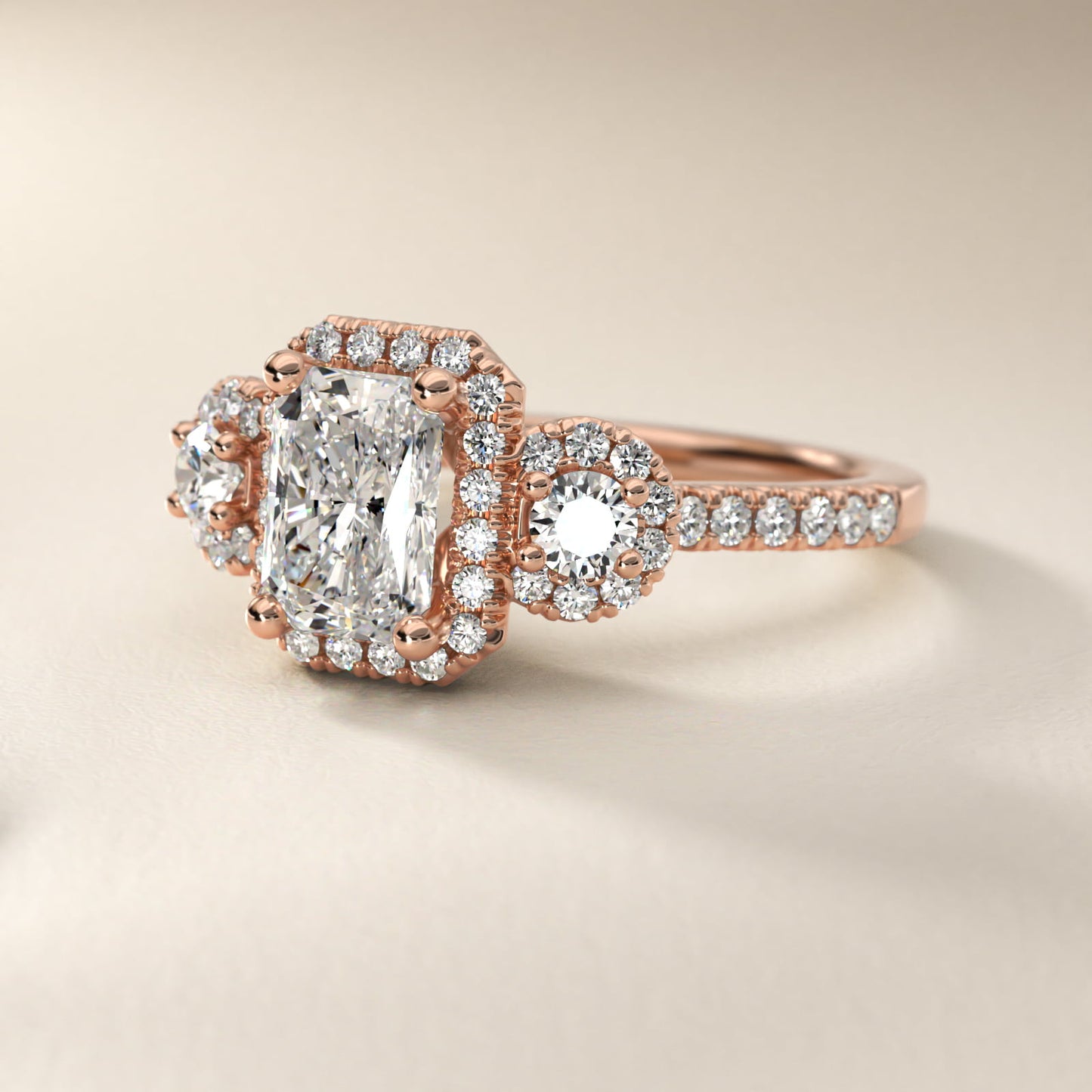 Three-Stone Halo Diamond Engagement Ring in 18k Rose Gold - Radiant Center