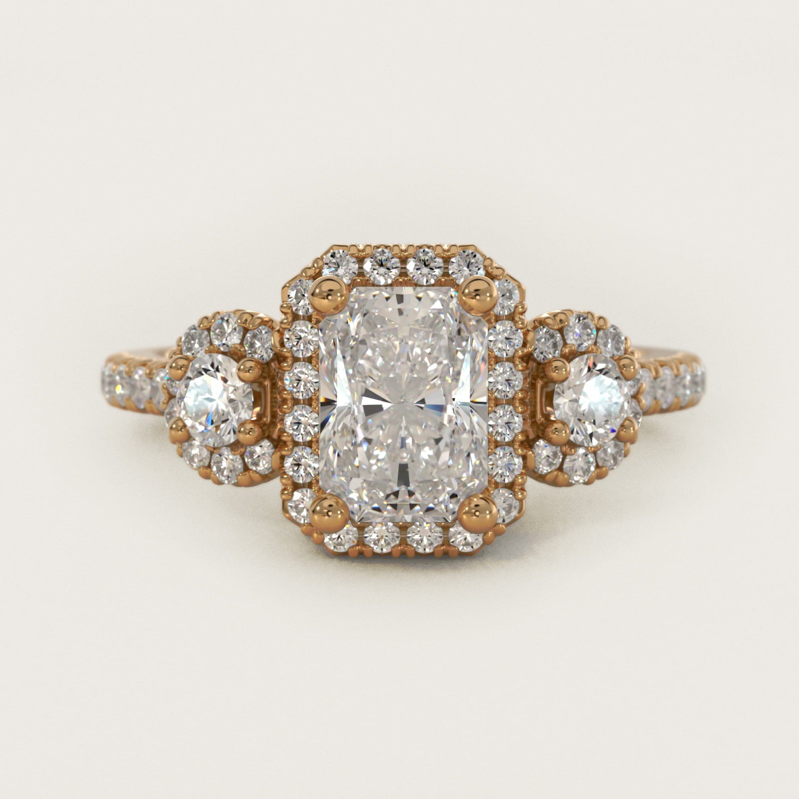 Three-Stone Halo Diamond Engagement Ring in 14k Yellow Gold - Radiant Center