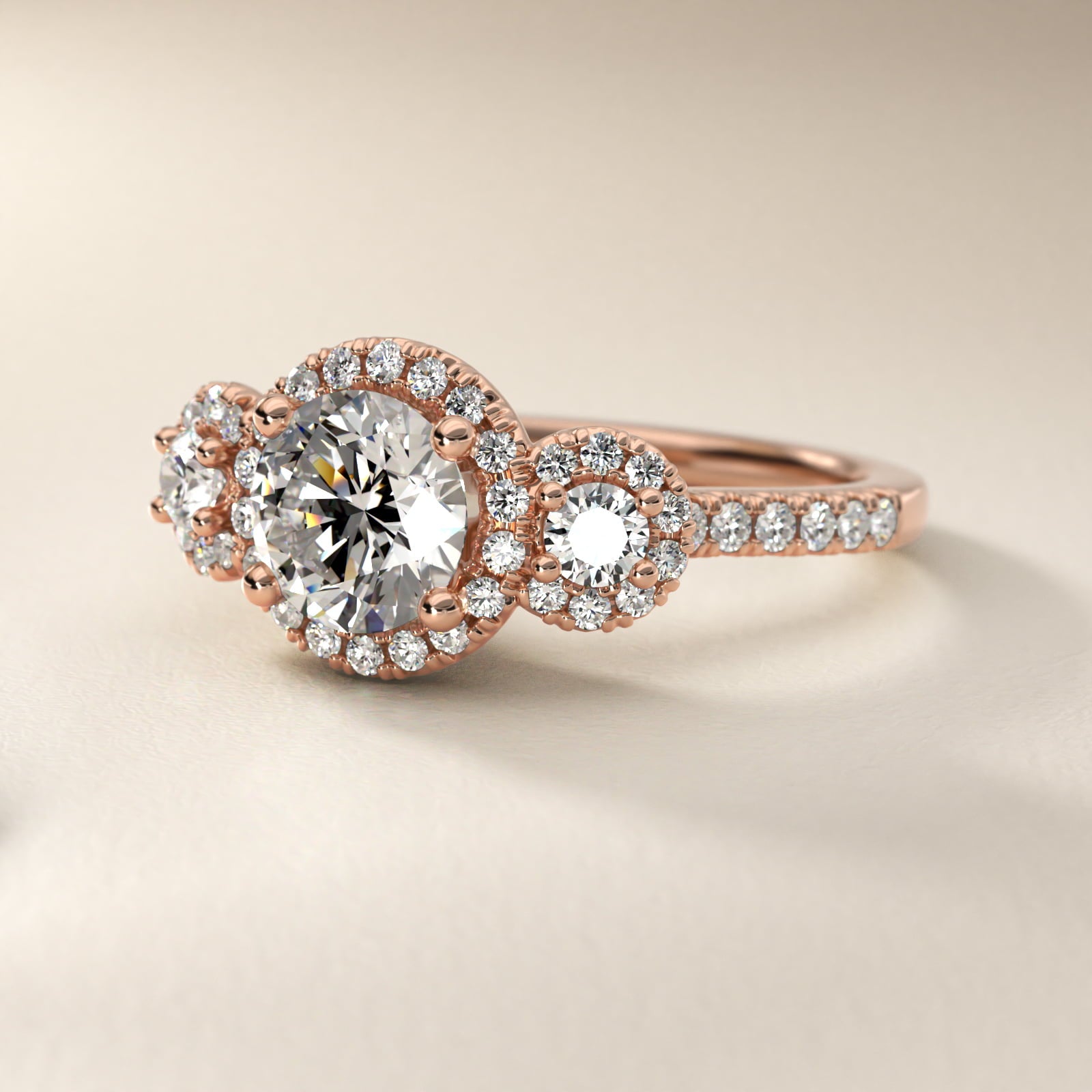 Three-Stone Halo Diamond Engagement Ring in 18k Rose Gold - Round Center