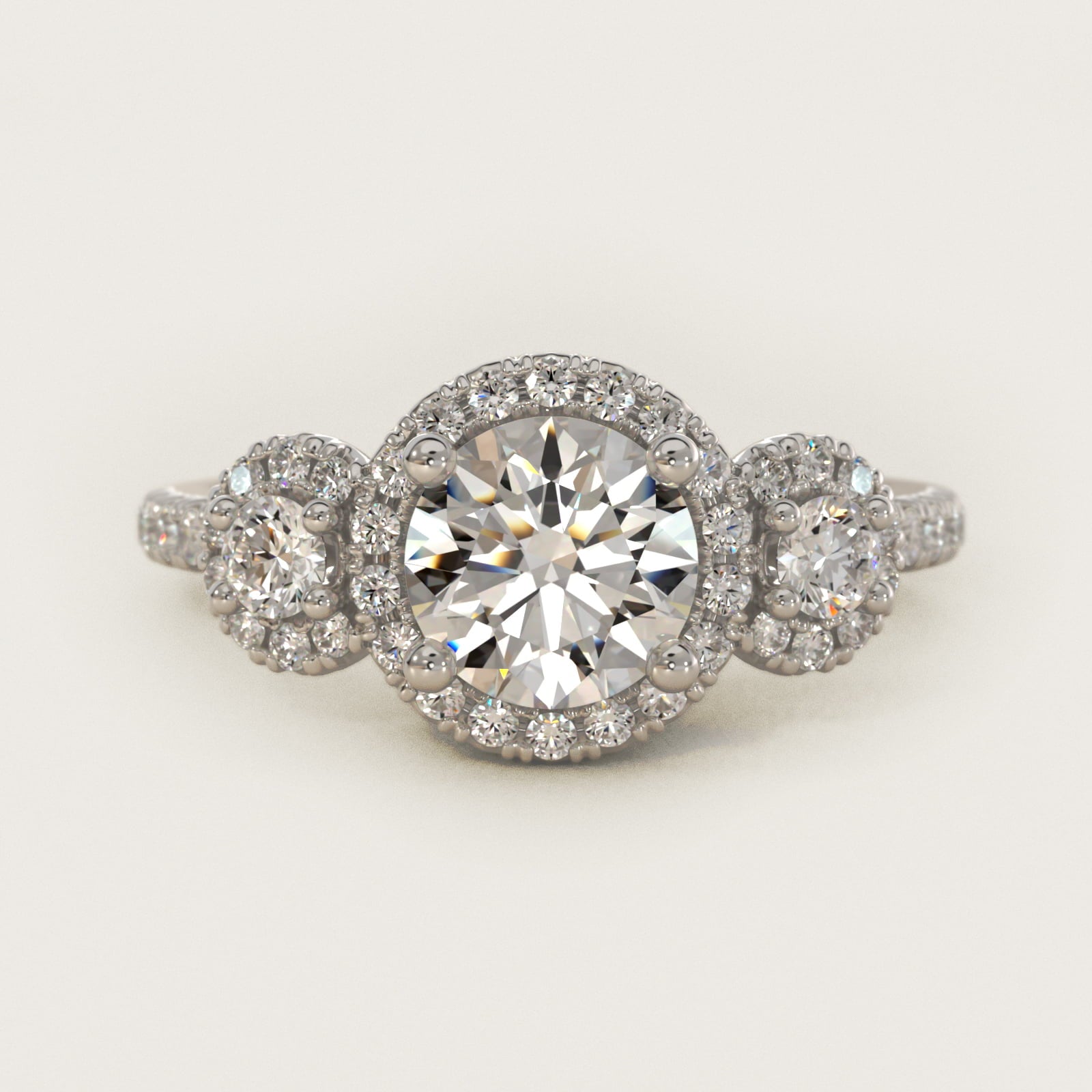 Three-Stone Halo Diamond Engagement Ring in Platinum - Round Center