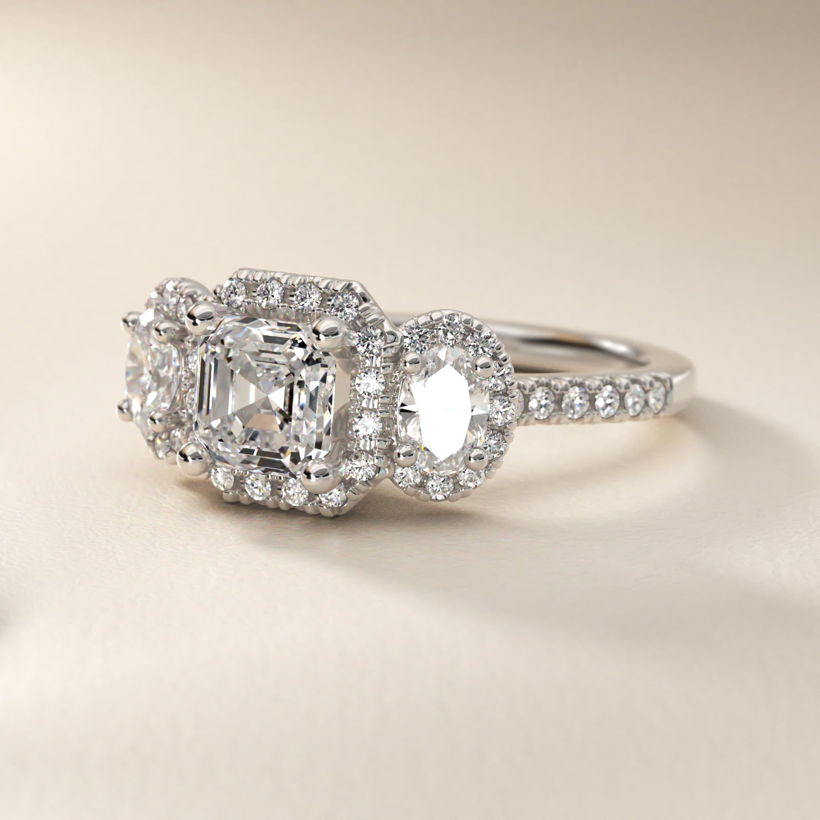 Three-Stone Oval Halo Diamond Engagement Ring in Platinum - Asscher Center